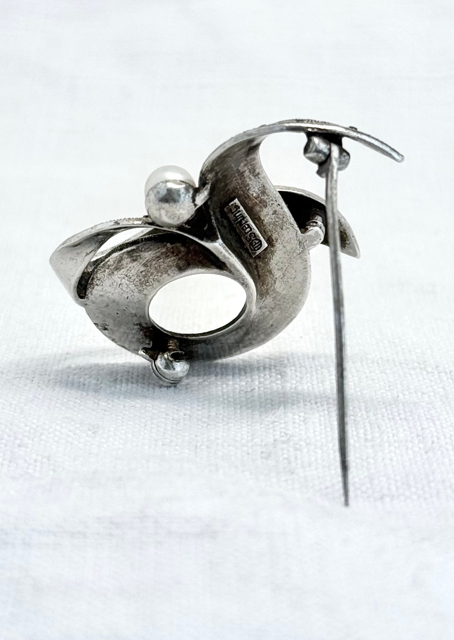 .1940s .1950s .925 silver Theodor Fahrner Mid Century Modern Art Deco revival renowned German Jurgendstill designer geometric swirl sterling silver, pearl and marcasite figural shape designer brooch pin