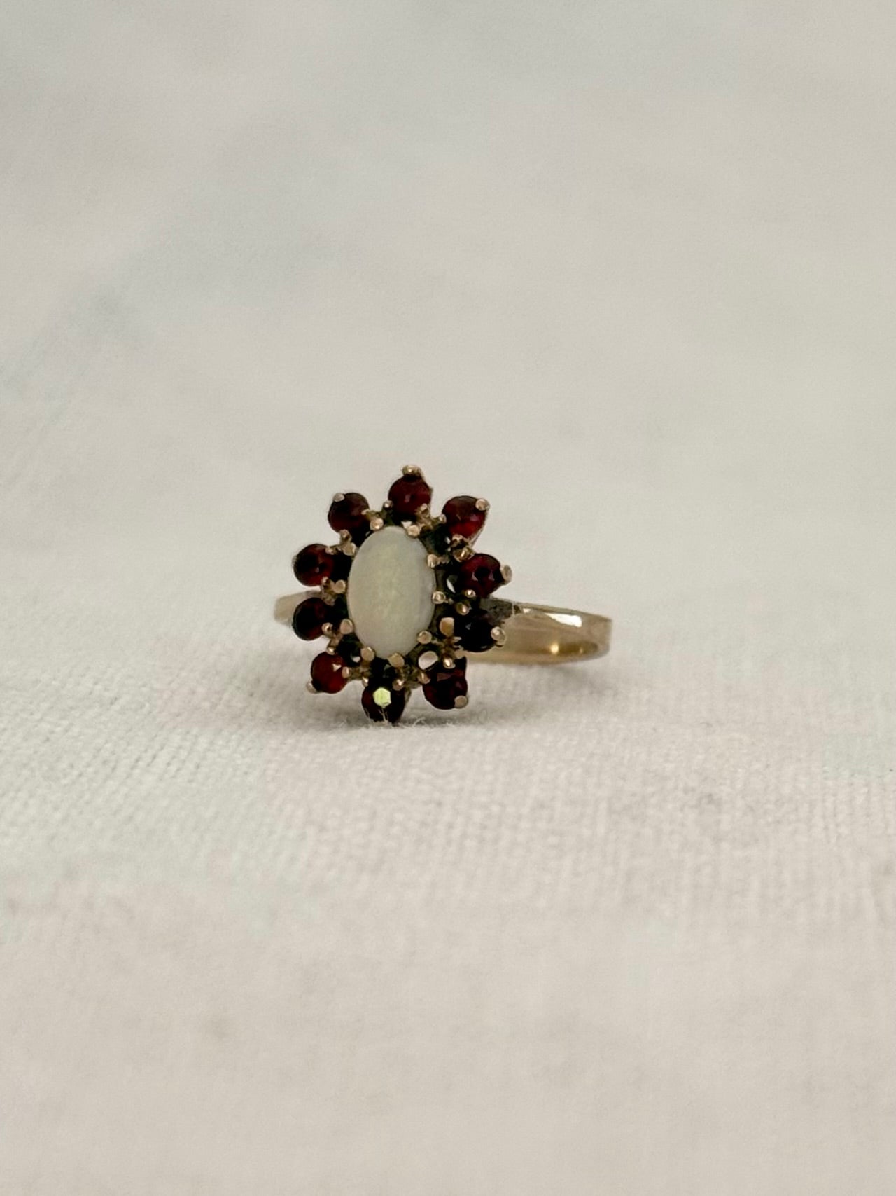 1930s .1940s .375 .9ct gold 1 opal 10 garnet 9ct yellow gold gemstone rosette halo flower cluster cocktail dress ring