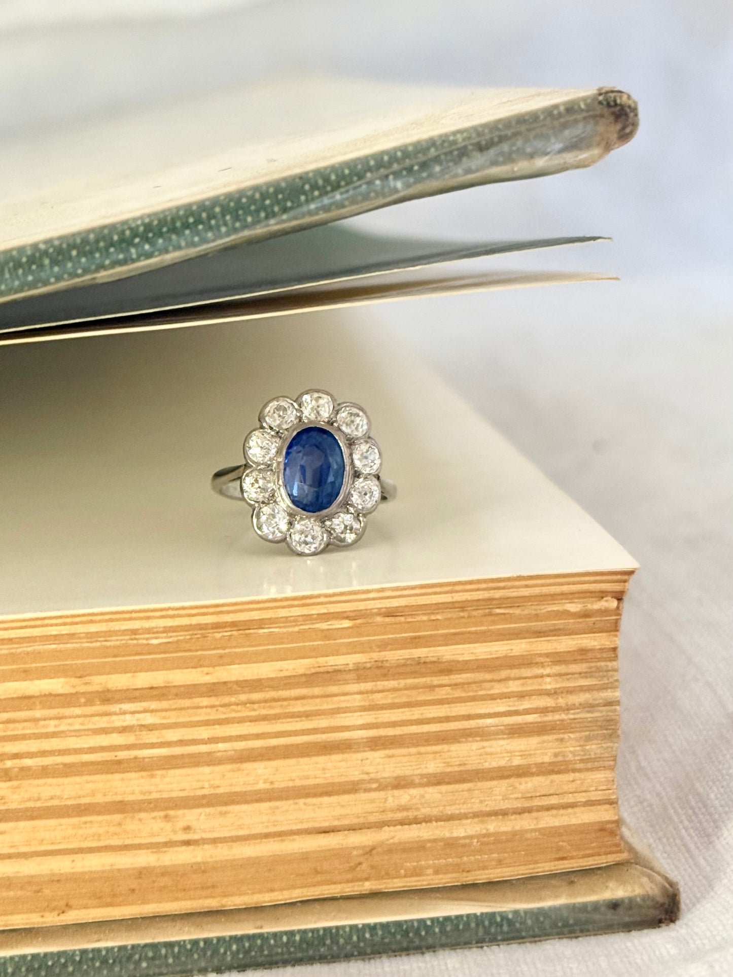 .18ct .1.20ct Old European cut diamonds and large 3.08ct Natural Sapphire era 1900s 1910s halo cluster white gold ring