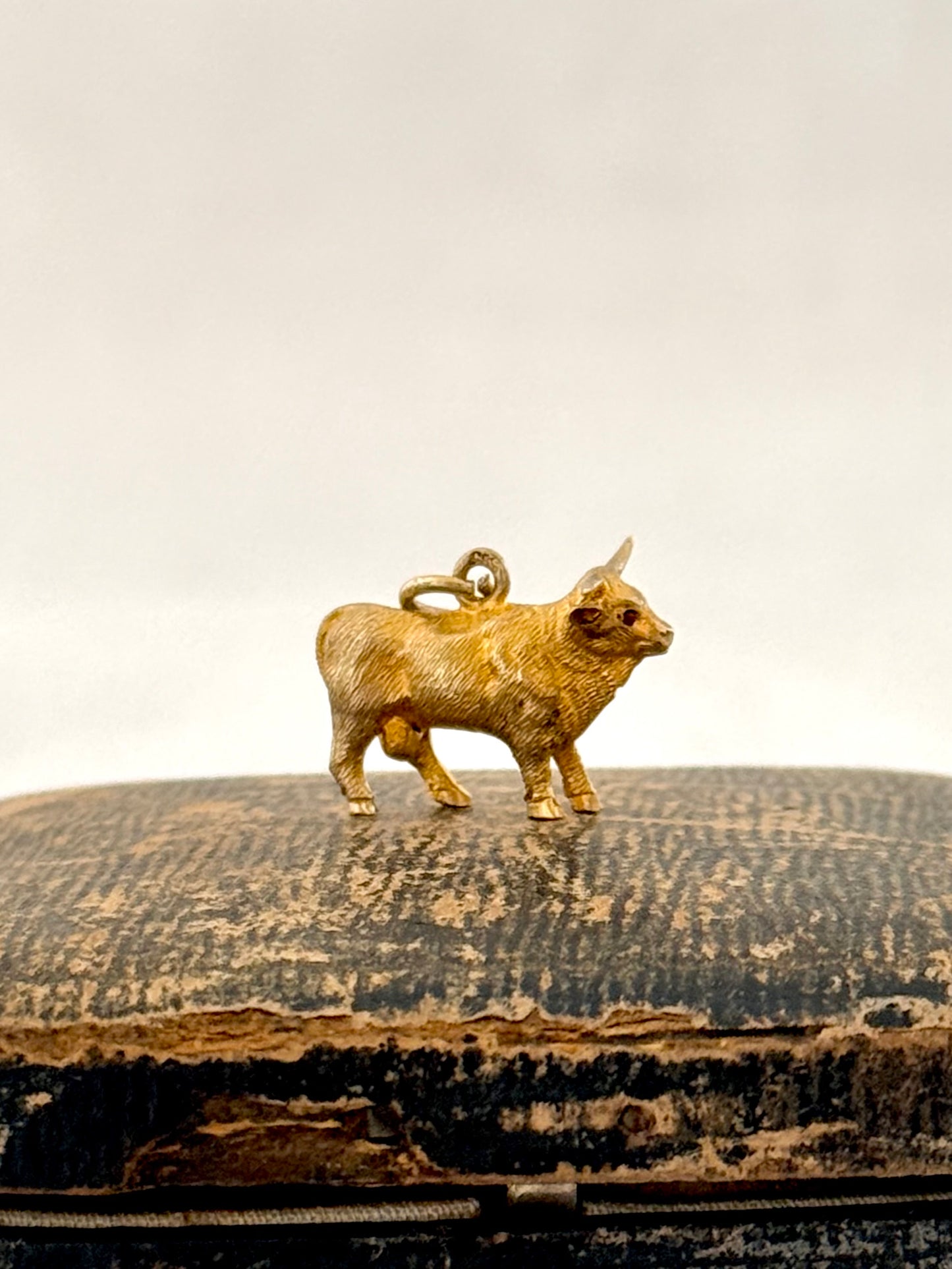 .14ct .1890s .1900s artisan crafted 585 yellow gold finely detailed Longhorn Heifer Bull figural charm with ruby eyes pendant