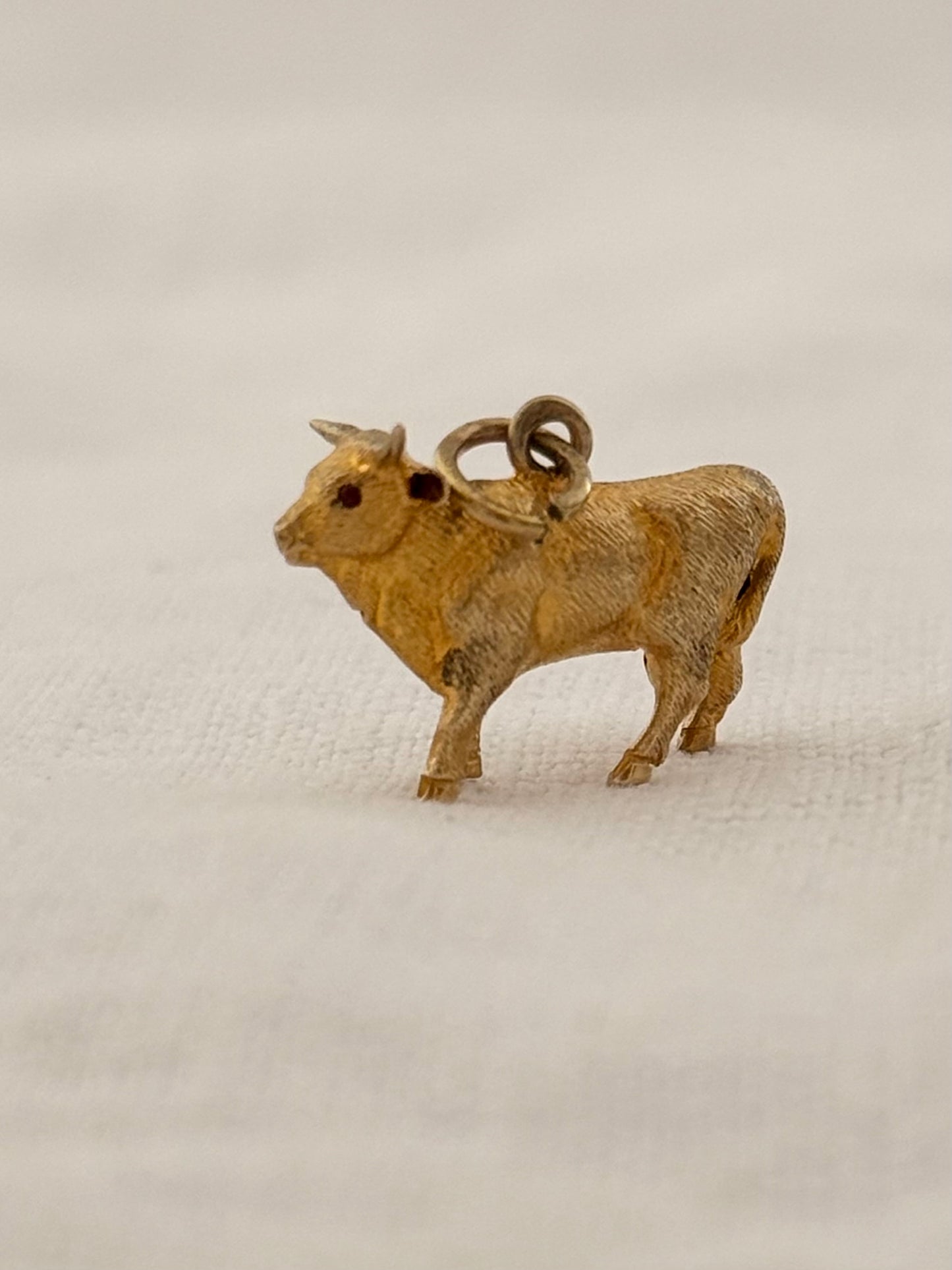 .14ct .1890s .1900s artisan crafted 585 yellow gold finely detailed Longhorn Heifer Bull figural charm with ruby eyes pendant