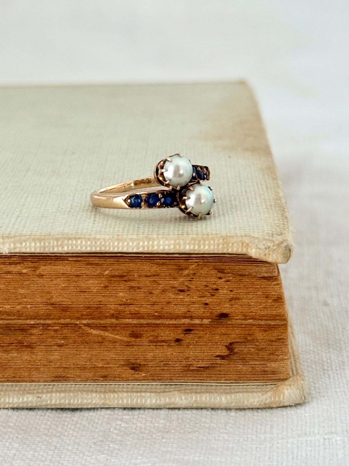.14ct .1880s .1900s .585 gold antique Victorian Edwardian treasure Toi et Moi double pearl and sapphire bypass sweetheart commitment ring