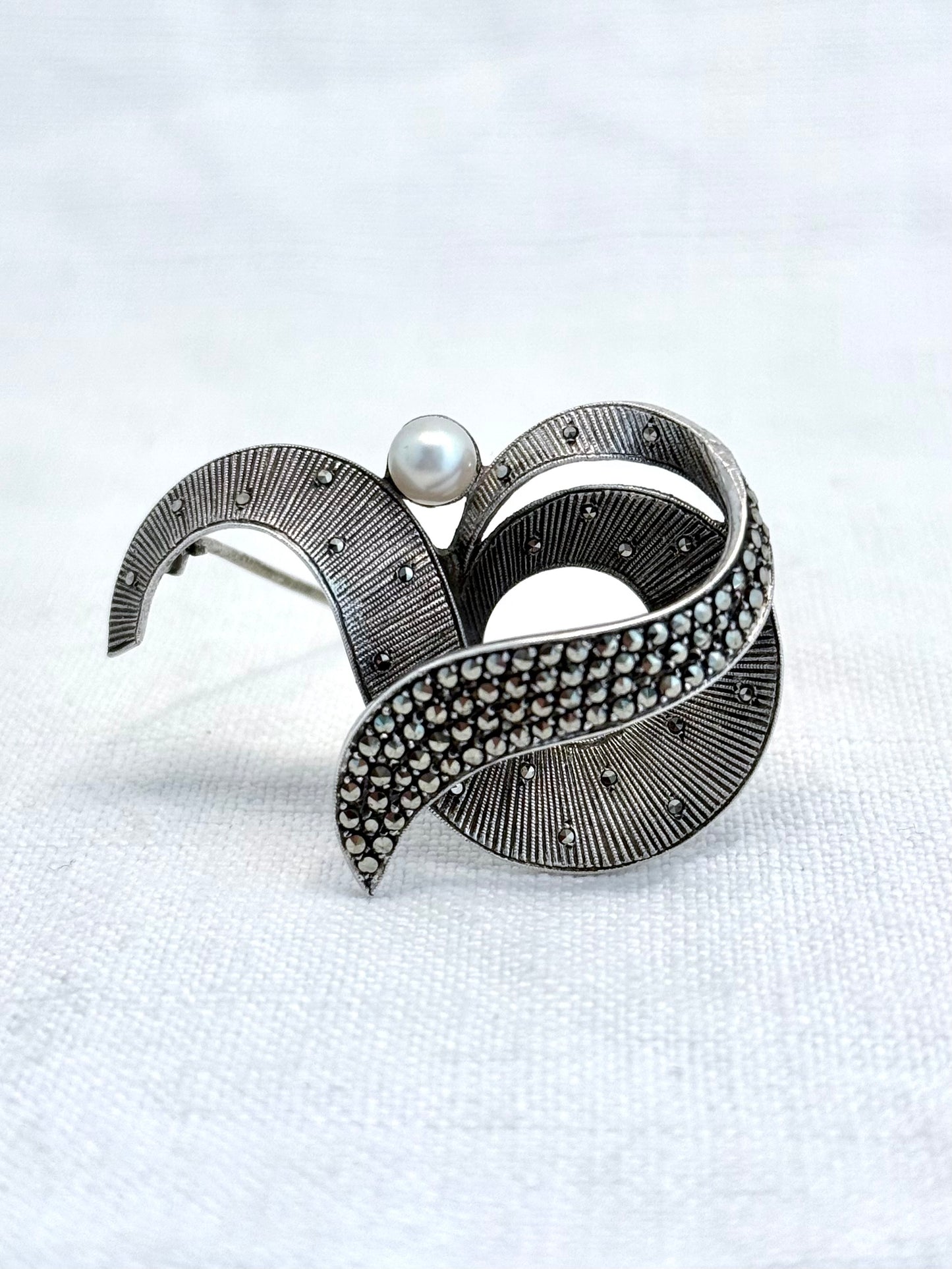 .1940s .1950s .925 silver Theodor Fahrner Mid Century Modern Art Deco revival renowned German Jurgendstill designer geometric swirl sterling silver, pearl and marcasite figural shape designer brooch pin