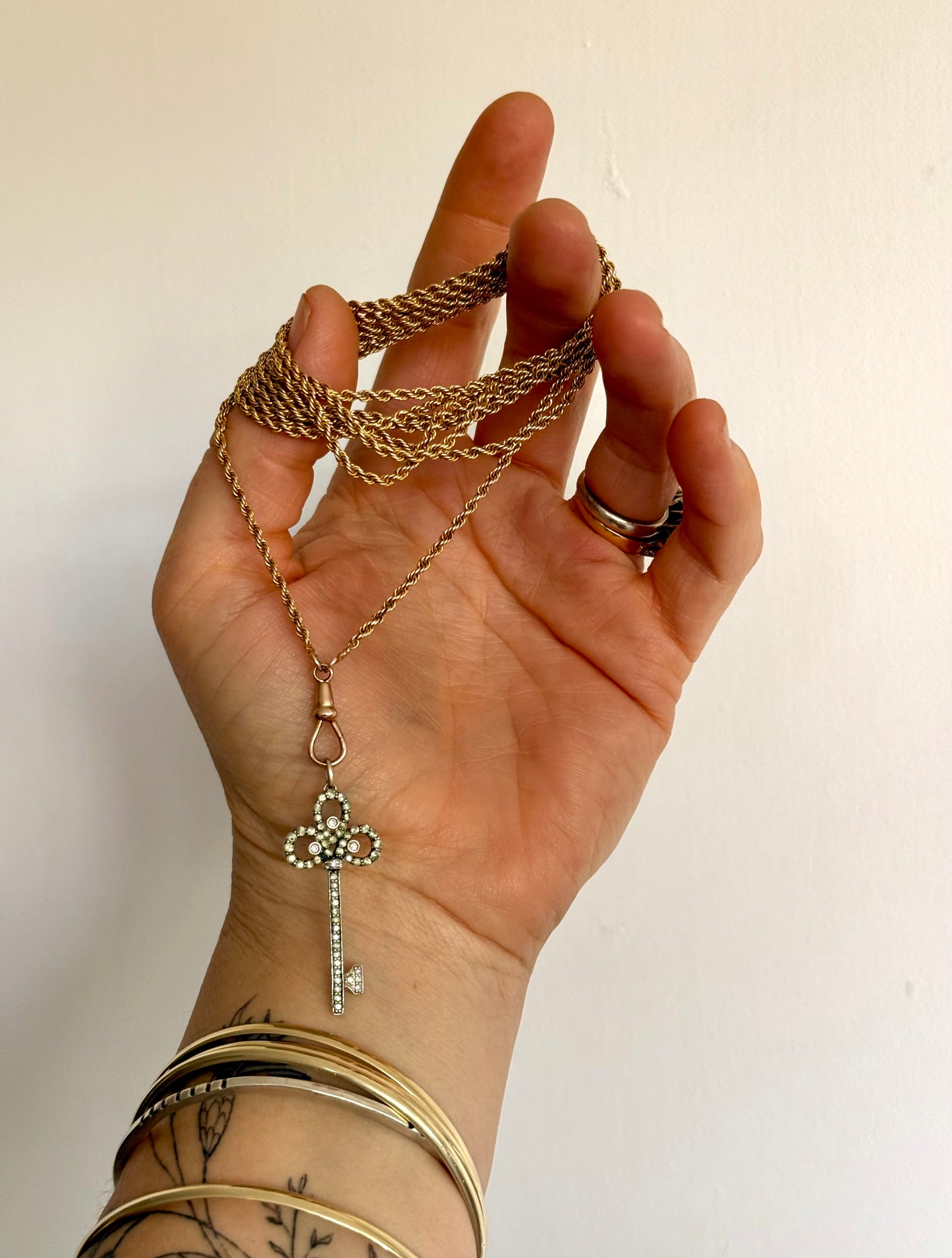 .18ct .750 .60 diamonds Brazilian designer white gold antique revival modernist diamond key luxury 18ct high carat gold and diamond studded romantic clover leaf key pendant