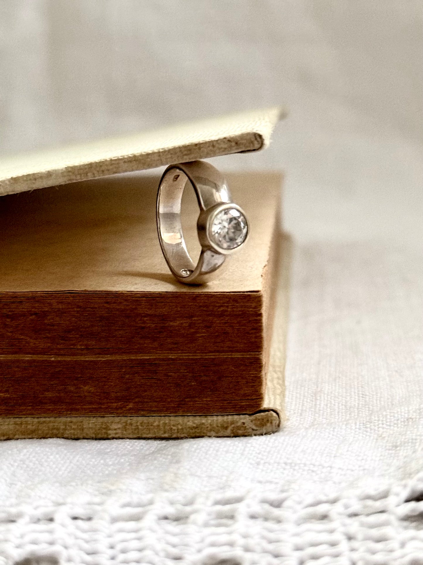 .925 classic large solitaire clear gemstone in wide set bezel set silver engagement style ring