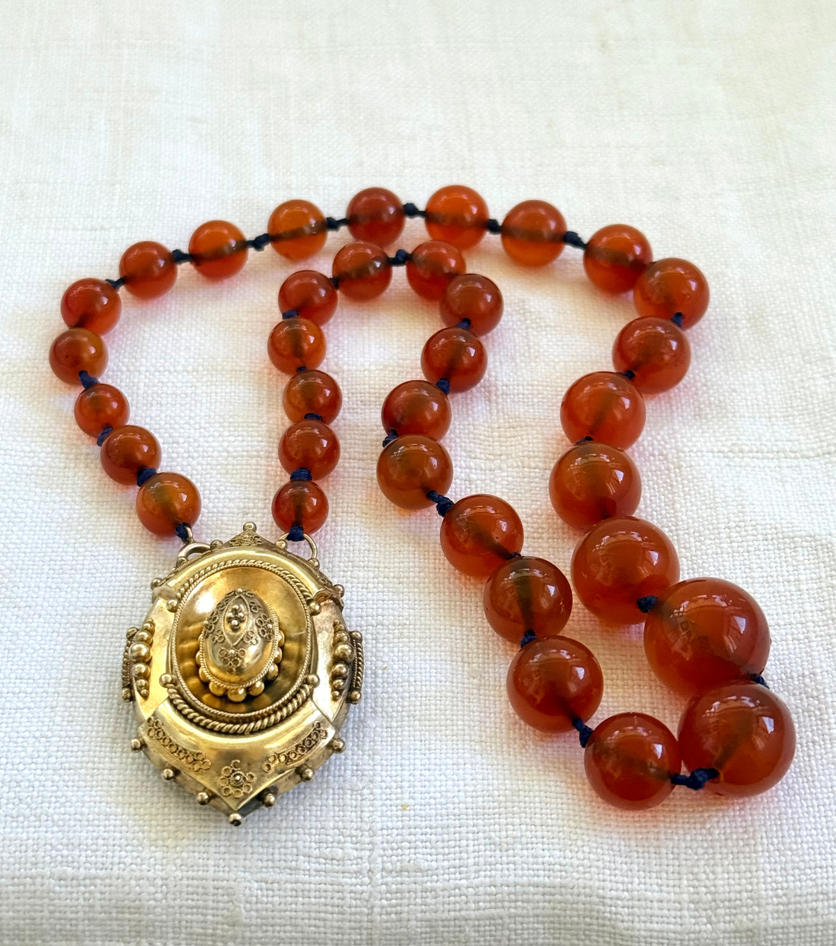 .1800s .375 .9ct gold Antique decorative fine Etruscan revival Victorian ornate gold oval pendant on luxury Carnelian bead graduated gemstone necklace setting