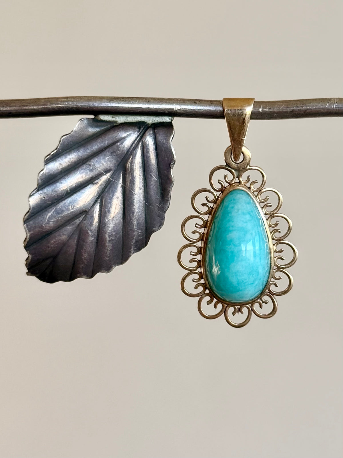 .1940s .1950s .375 .9ct gold Amazonite vintage yellow gold modernist teardrop pear shaped filigree scroll form frame blue green gemstone drop pendant.