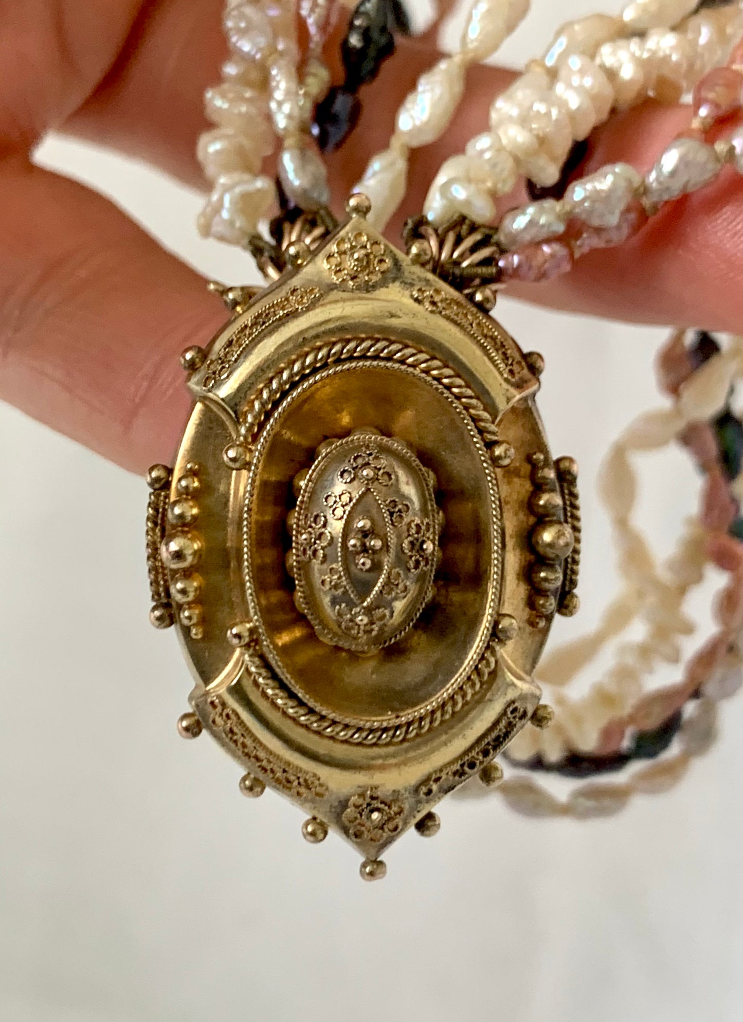 1800s 9ct gold Antique Etruscan revival Victorian yellow gold high detailed ornate oval pendant on dreamy shell coloured multi string 5 x string fresh water rice pearl necklace