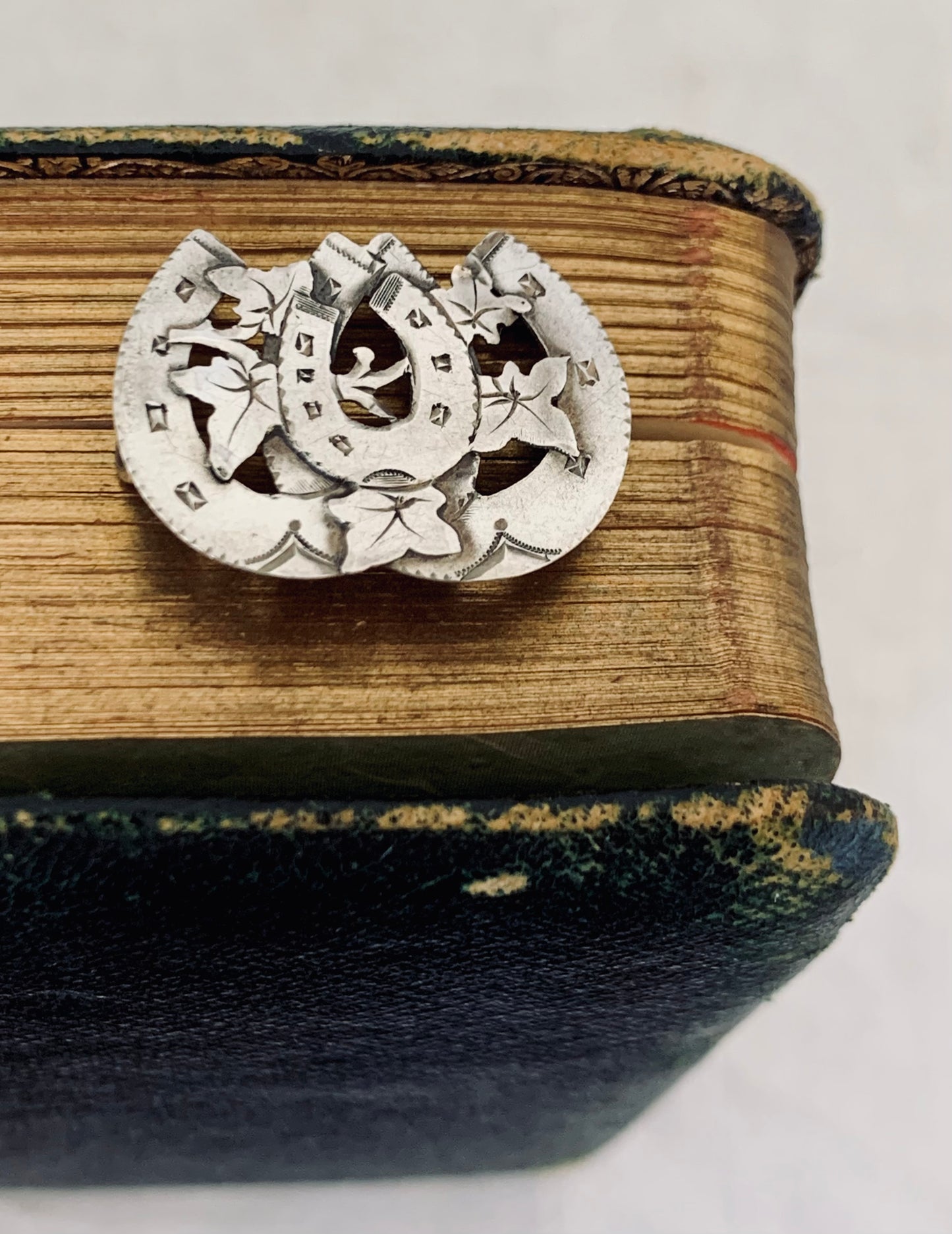 circa 1891 Victorian sentimental triple three horse shoe Aesthetic movement hallmarked hallmark sterling silver brooch.