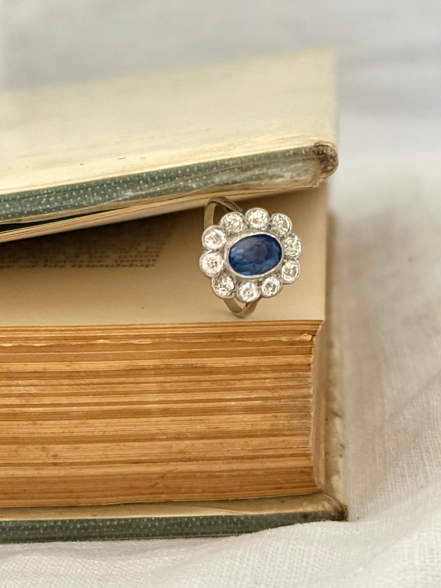 .18ct .1.20ct Old European cut diamonds and large 3.08ct Natural Sapphire era 1900s 1910s halo cluster white gold ring