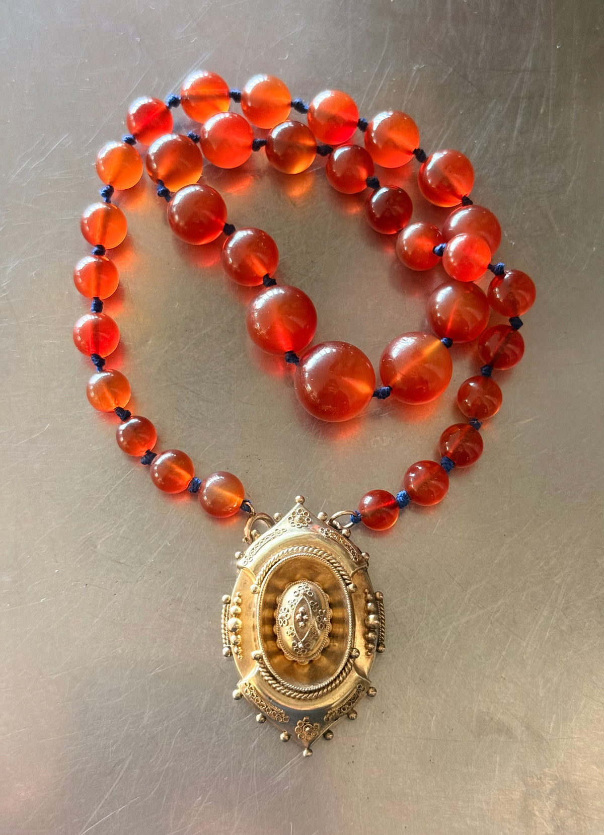 .1800s .375 .9ct gold Antique decorative fine Etruscan revival Victorian ornate gold oval pendant on luxury Carnelian bead graduated gemstone necklace setting