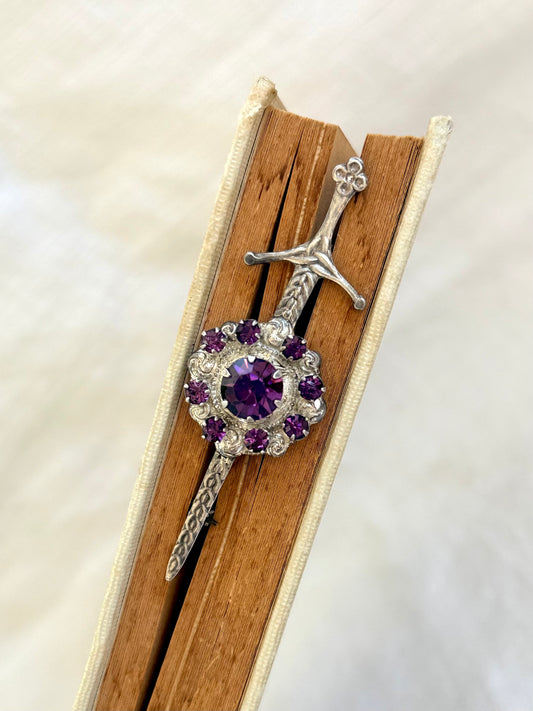 .1920s .1930s .925 Scottish silver Amethyst paste sword and shield brooch.