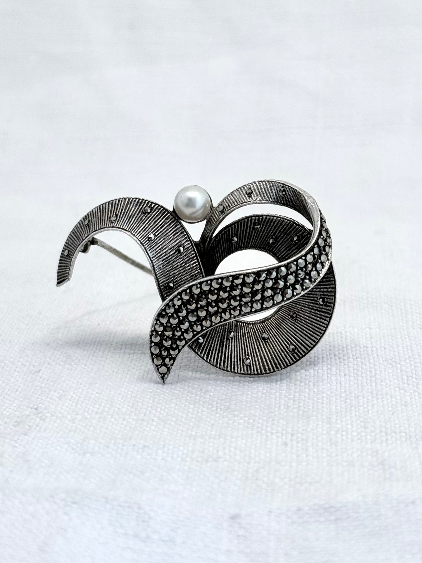 .1940s .1950s .925 silver Theodor Fahrner Mid Century Modern Art Deco revival renowned German Jurgendstill designer geometric swirl sterling silver, pearl and marcasite figural shape designer brooch pin