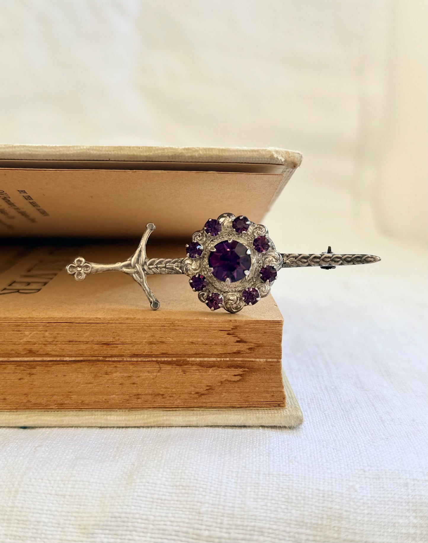 .1920s .1930s .925 Scottish silver Amethyst paste sword and shield brooch.