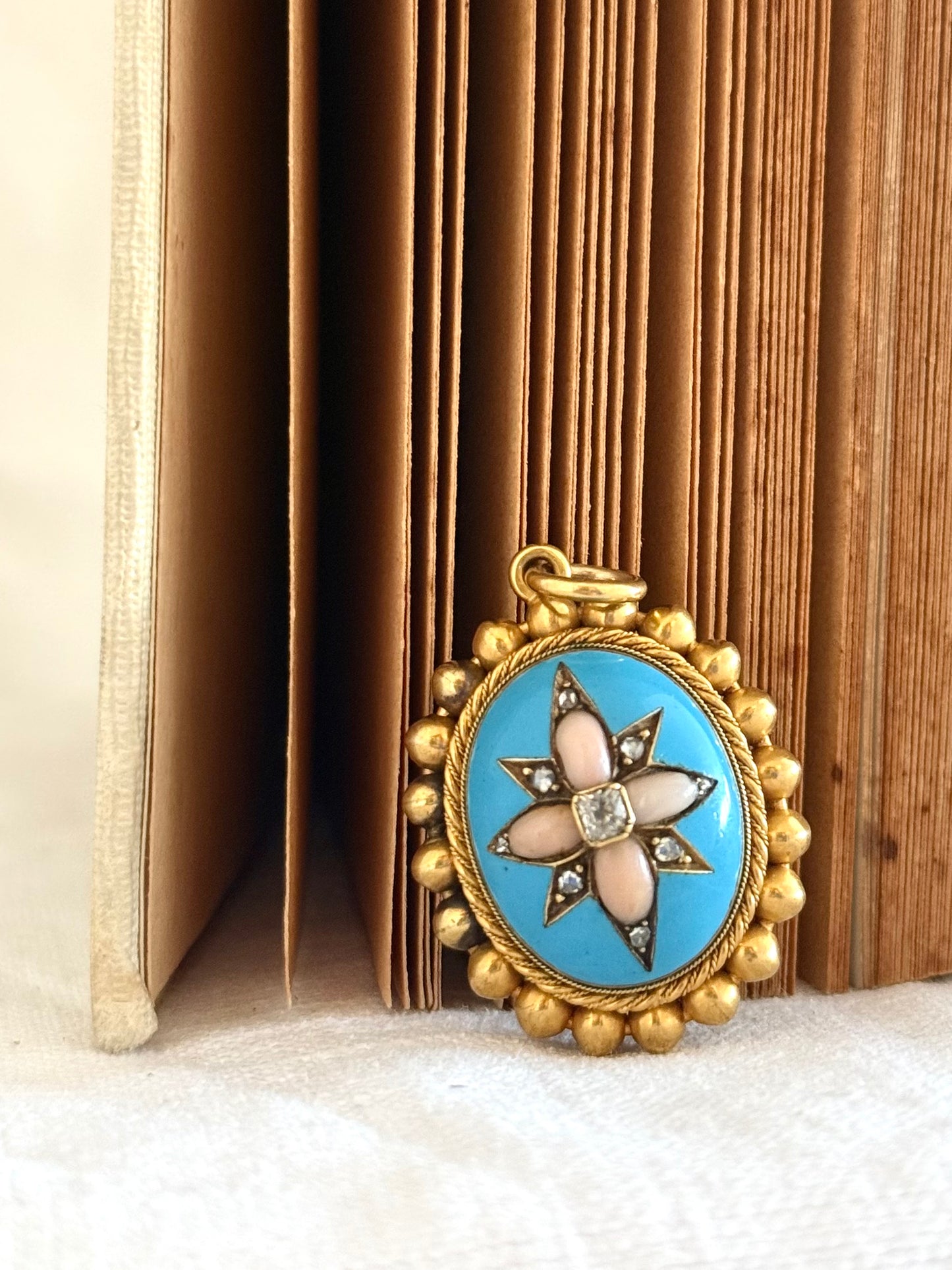 .15ct .1850s .1860s antique Victorian Yellow Gold Cushion cut Diamond Rose Cut Diamond star starburst Angel Coral and Blue Enamel Etruscan Revival Beaded border Mourning locket pendant