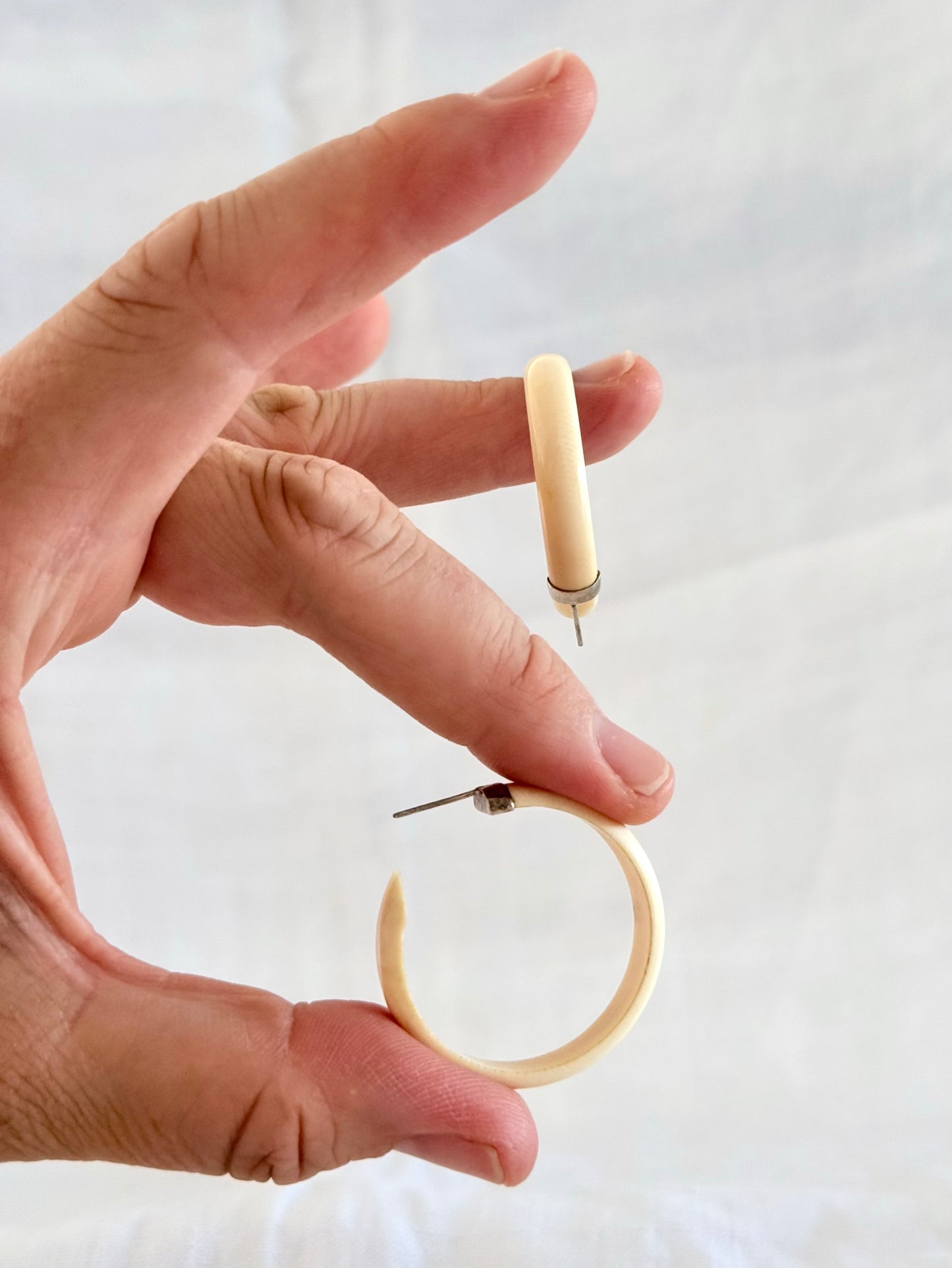 .1950s .1960s classic and gorgeous oversized pre ban Ivory hoop huggies capped in silver