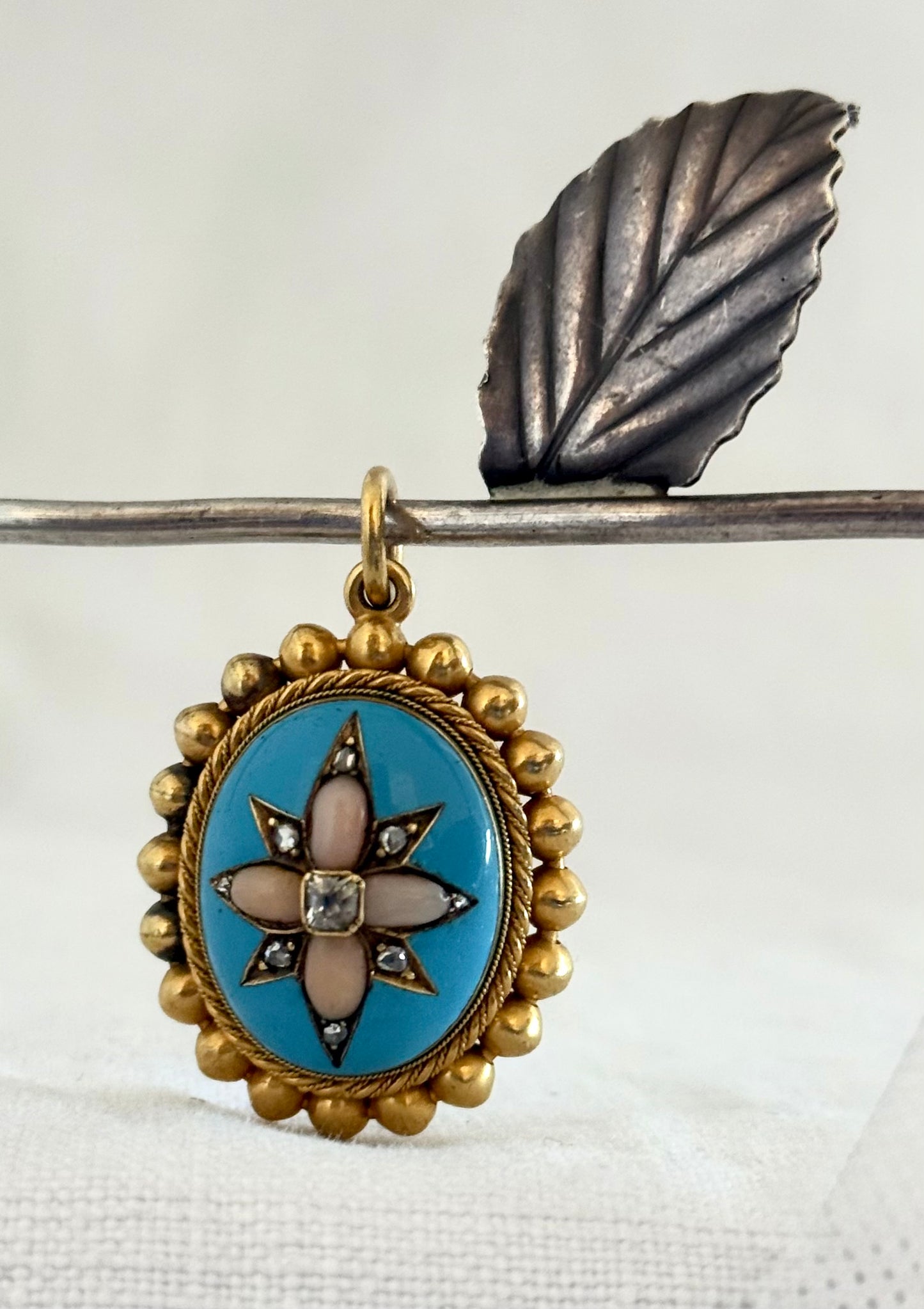 .15ct .1850s .1860s antique Victorian Yellow Gold Cushion cut Diamond Rose Cut Diamond star starburst Angel Coral and Blue Enamel Etruscan Revival Beaded border Mourning locket pendant