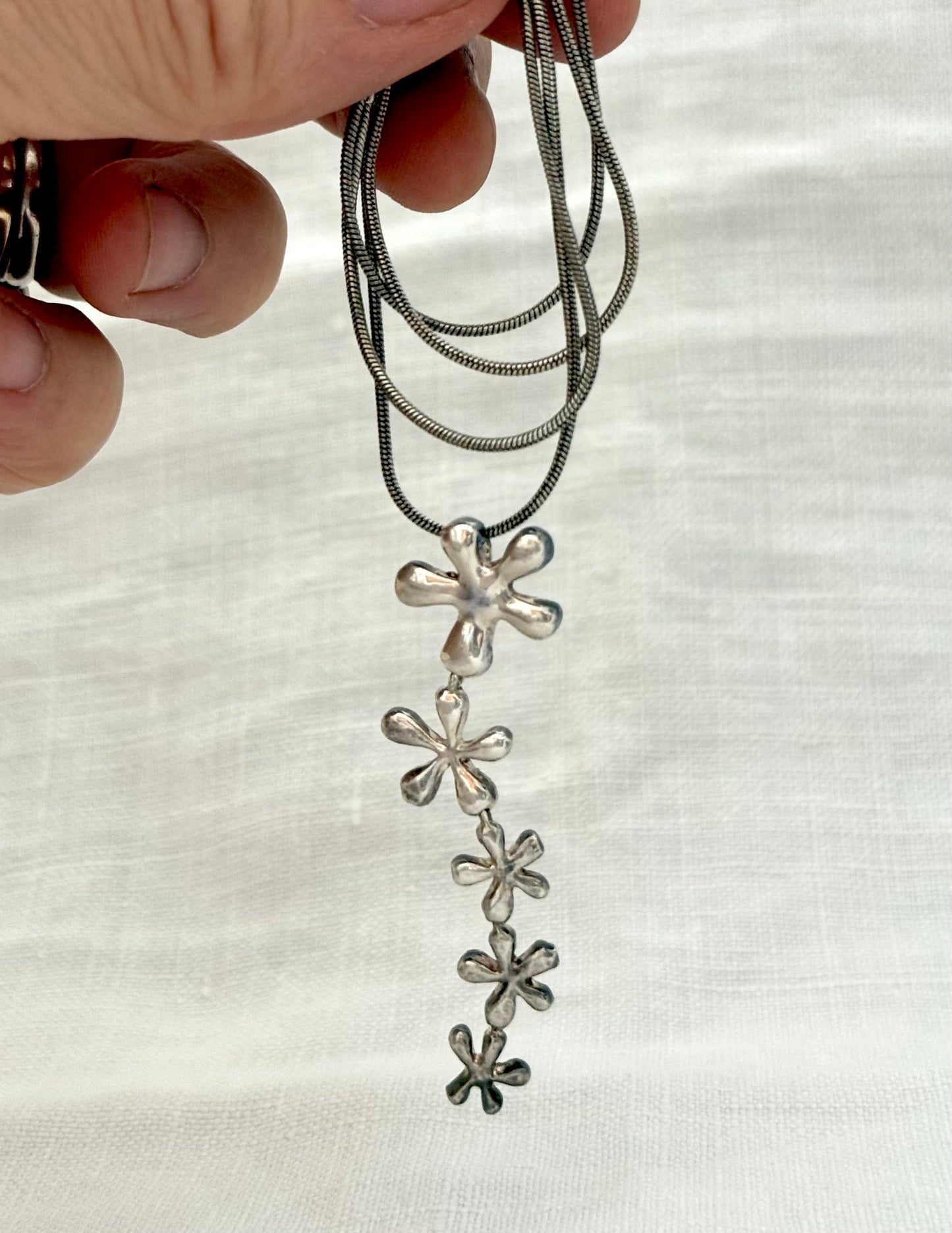 .925 .1950s revival modernist sterling silver floral waterfall drop pendant silver snake chain
