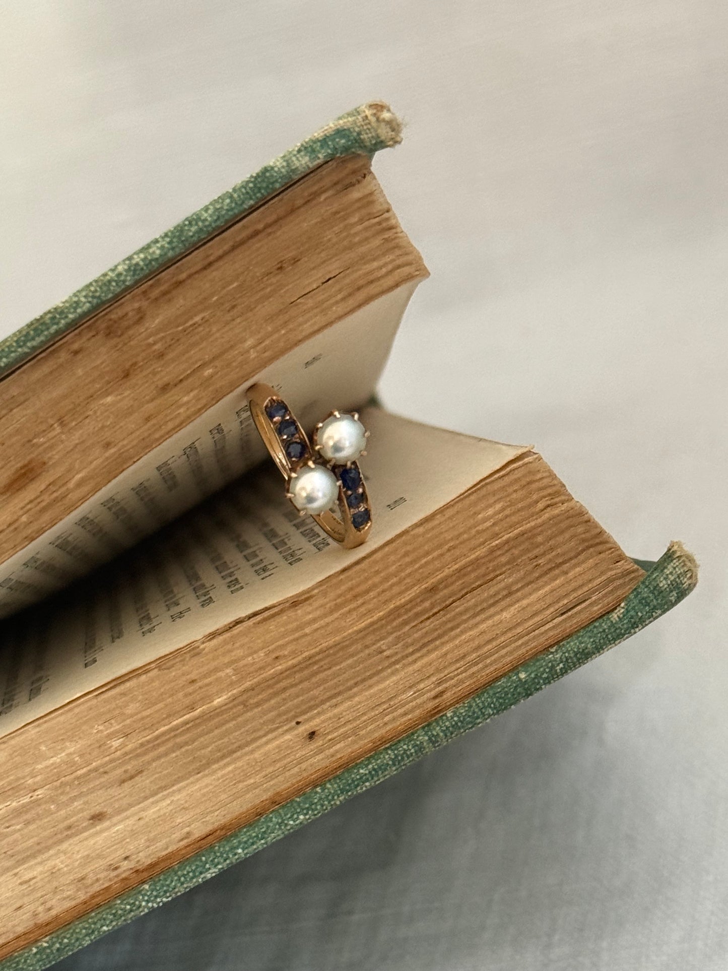 .14ct .1880s .1900s .585 gold antique Victorian Edwardian treasure Toi et Moi double pearl and sapphire bypass sweetheart commitment ring