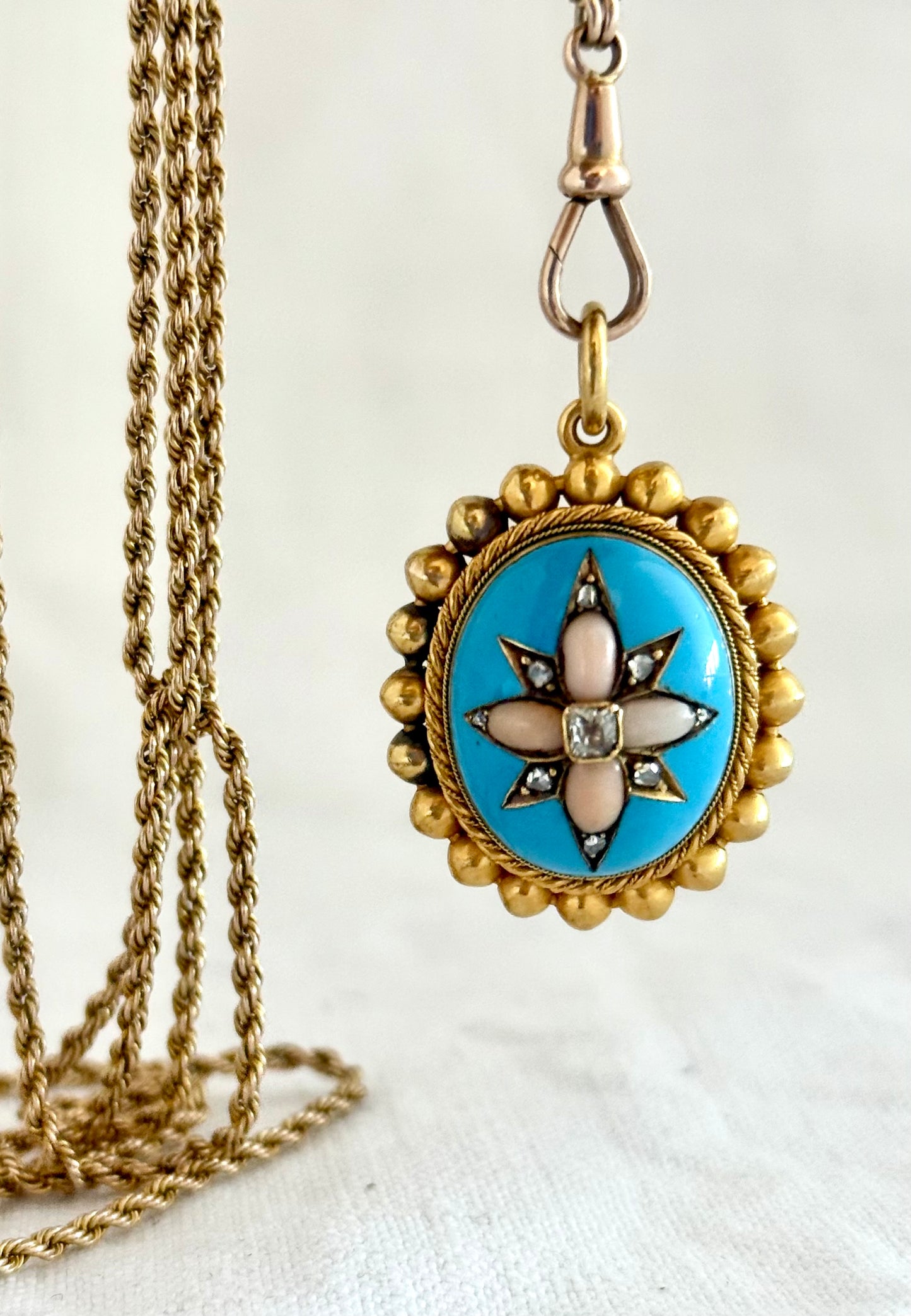 .15ct .1850s .1860s antique Victorian Yellow Gold Cushion cut Diamond Rose Cut Diamond star starburst Angel Coral and Blue Enamel Etruscan Revival Beaded border Mourning locket pendant