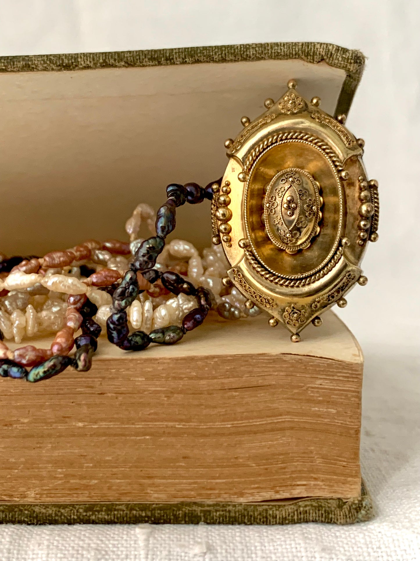 1800s 9ct gold Antique Etruscan revival Victorian yellow gold high detailed ornate oval pendant on dreamy shell coloured multi string 5 x string fresh water rice pearl necklace