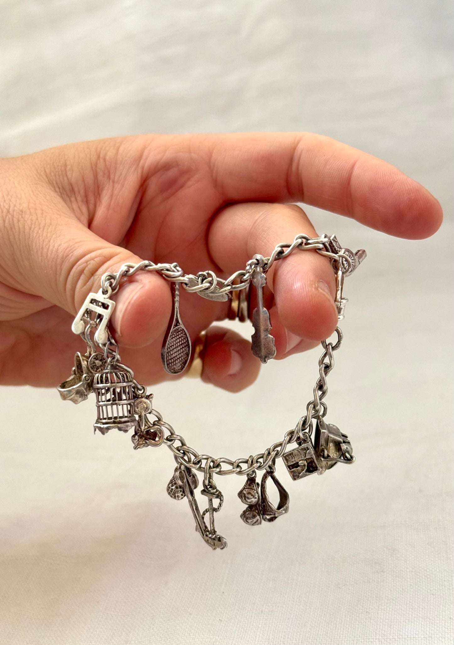 .14 charms .1970s .925 dangly keepsake charm bracelet