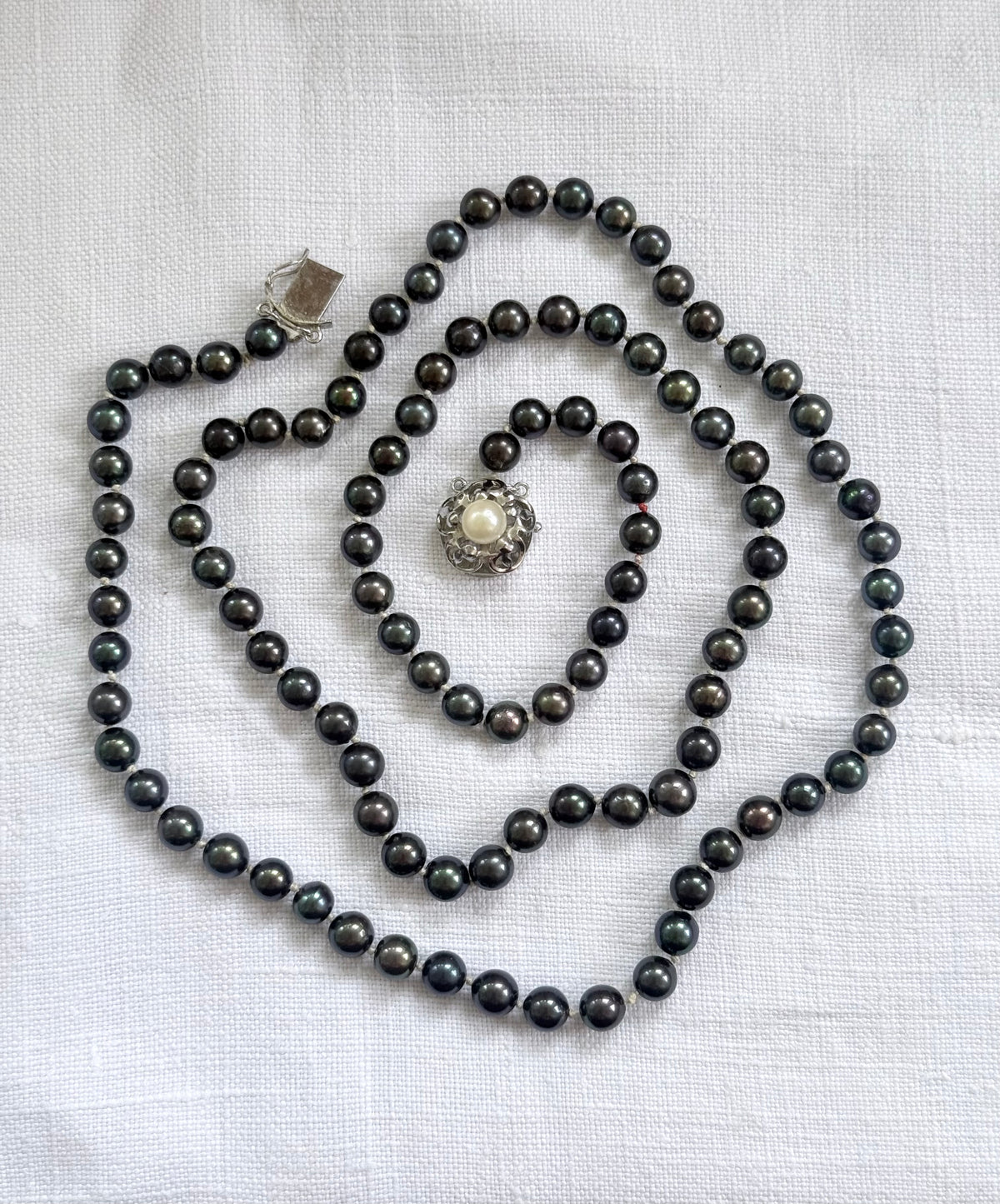 .925 .77.5cm long luxury cultured pearl real Tahitian purple petrol brown knotted Pearl necklace with floral sterling silver box clasp