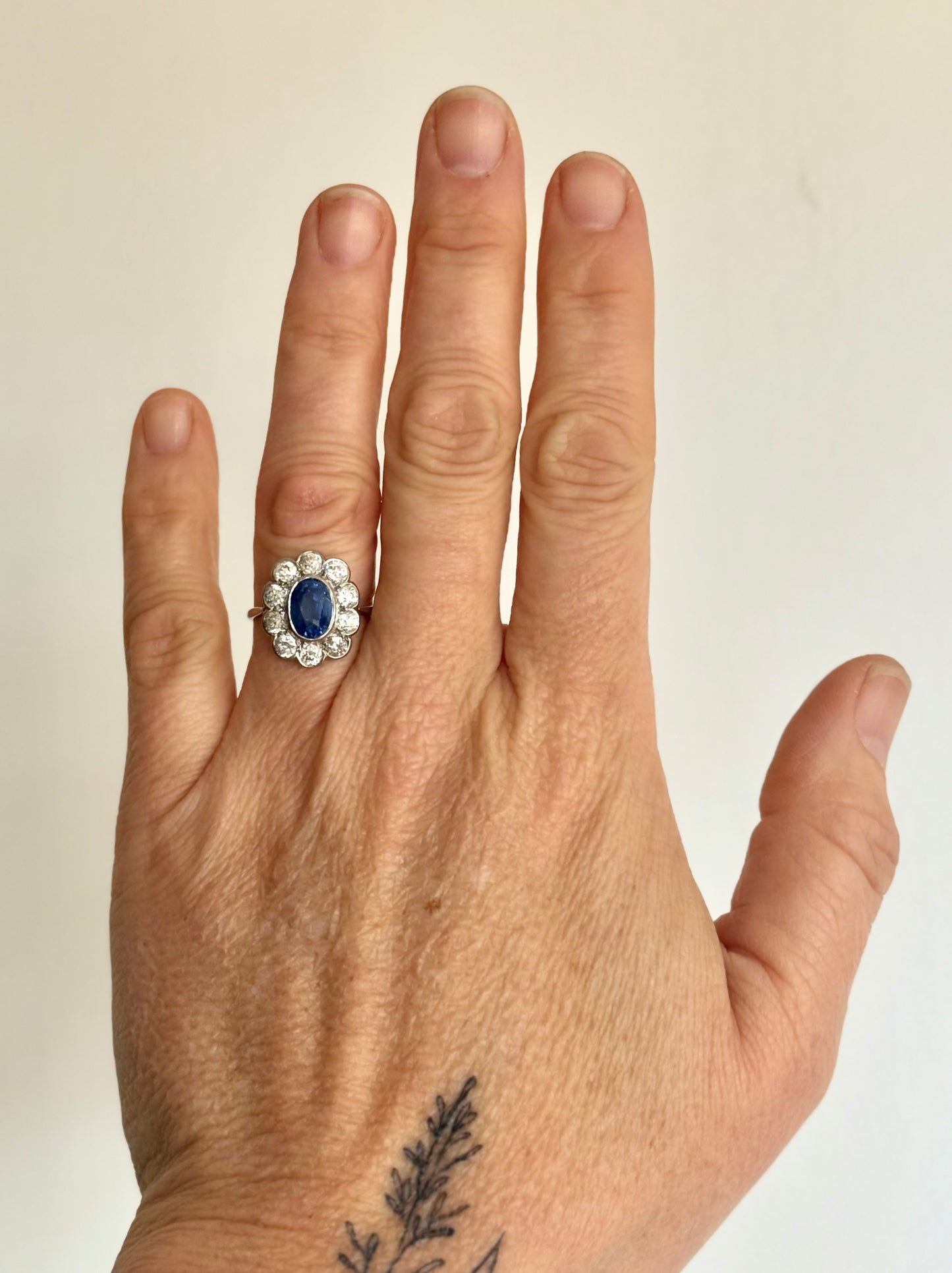 .18ct .1.20ct Old European cut diamonds and large 3.08ct Natural Sapphire era 1900s 1910s halo cluster white gold ring