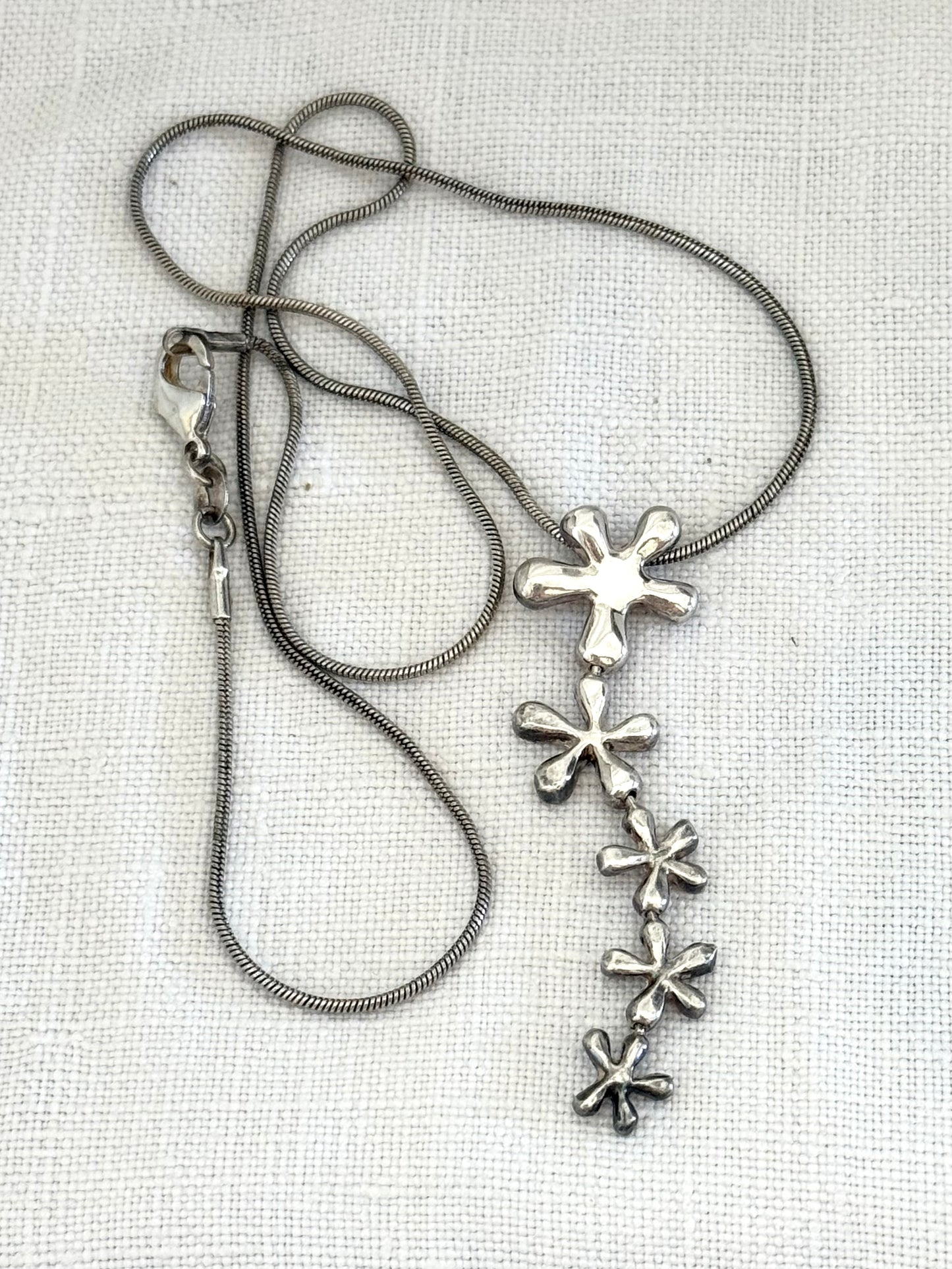 .925 .1950s revival modernist sterling silver floral waterfall drop pendant silver snake chain