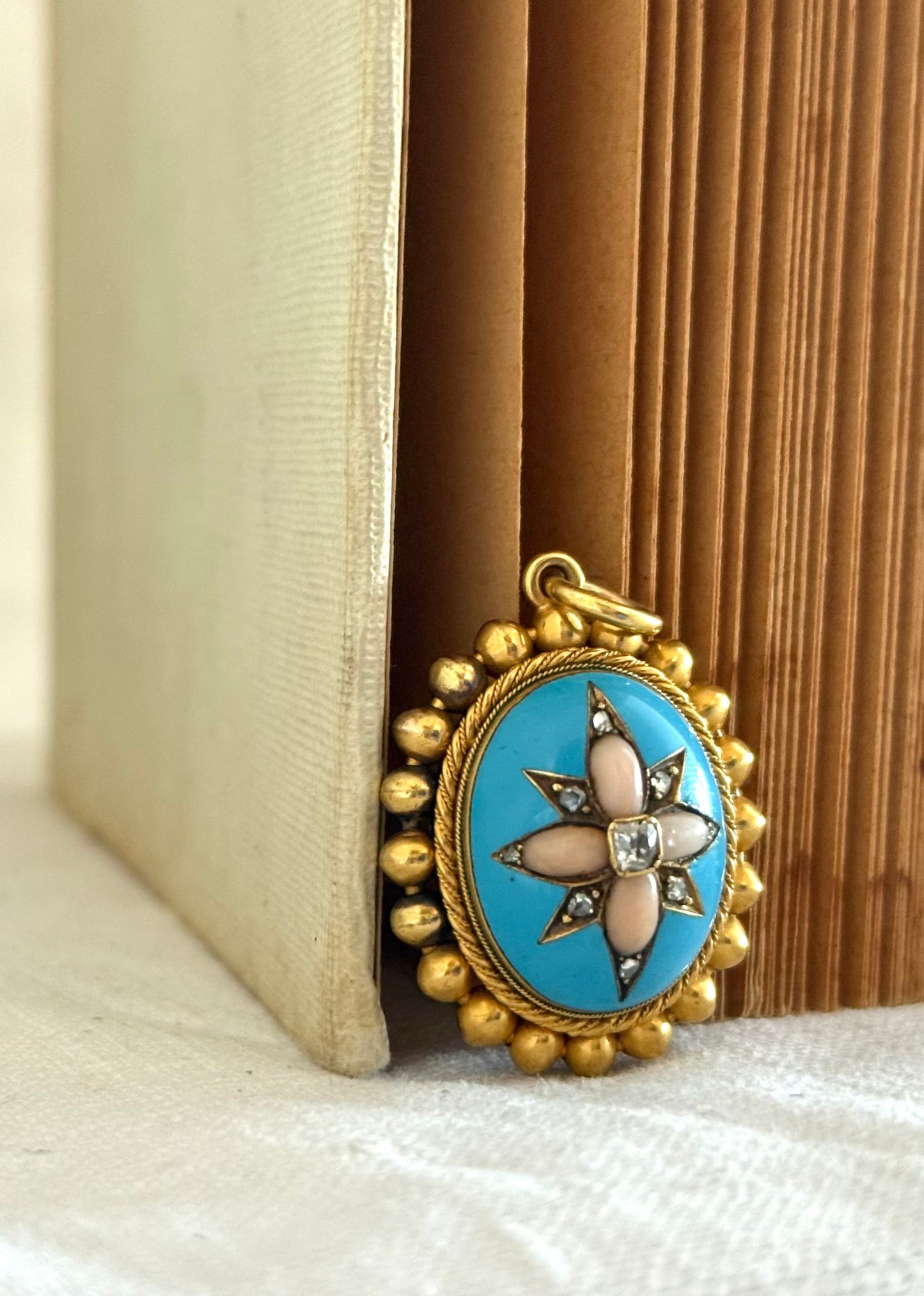 .15ct .1850s .1860s antique Victorian Yellow Gold Cushion cut Diamond Rose Cut Diamond star starburst Angel Coral and Blue Enamel Etruscan Revival Beaded border Mourning locket pendant