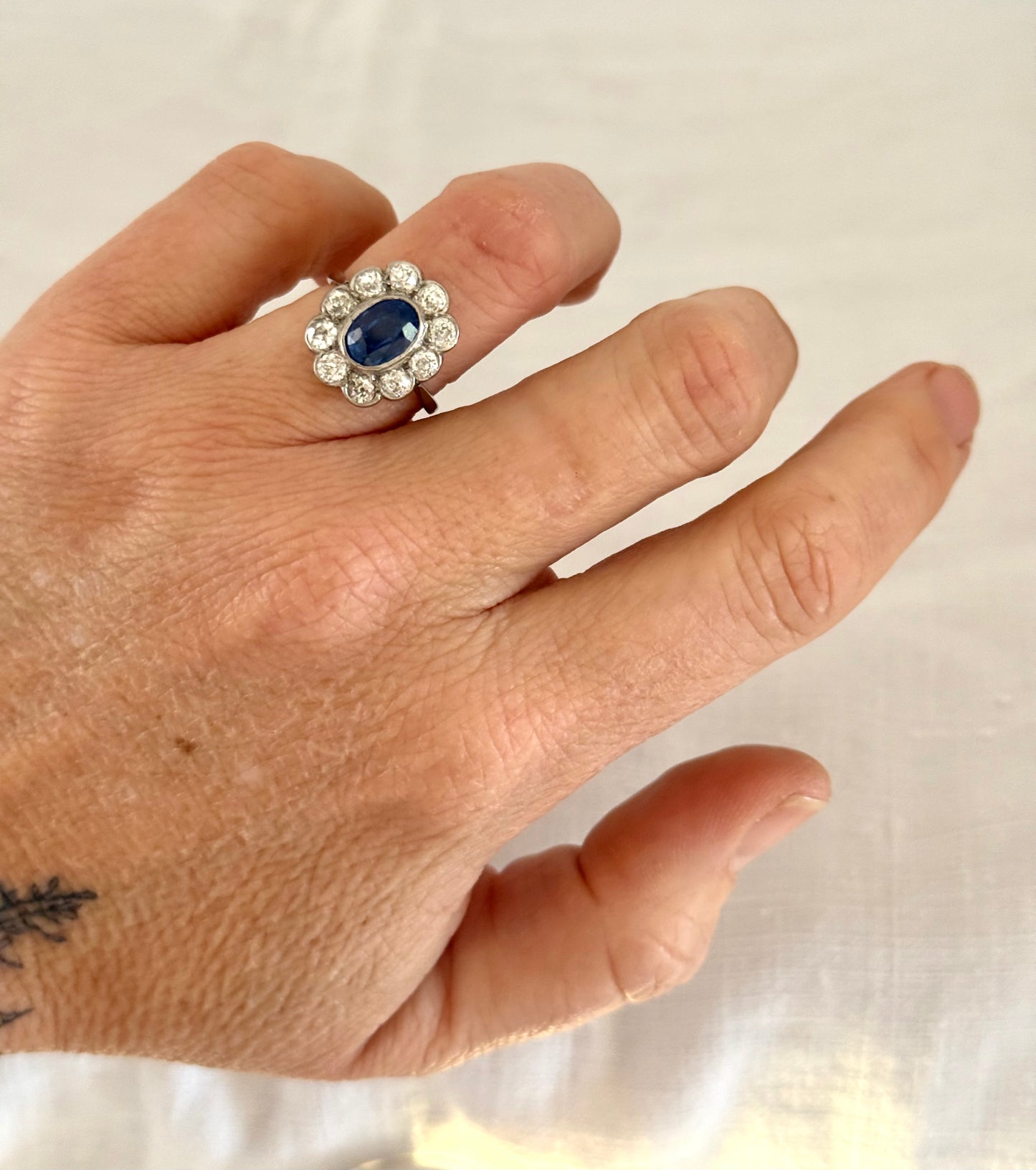 .18ct .1.20ct Old European cut diamonds and large 3.08ct Natural Sapphire era 1900s 1910s halo cluster white gold ring