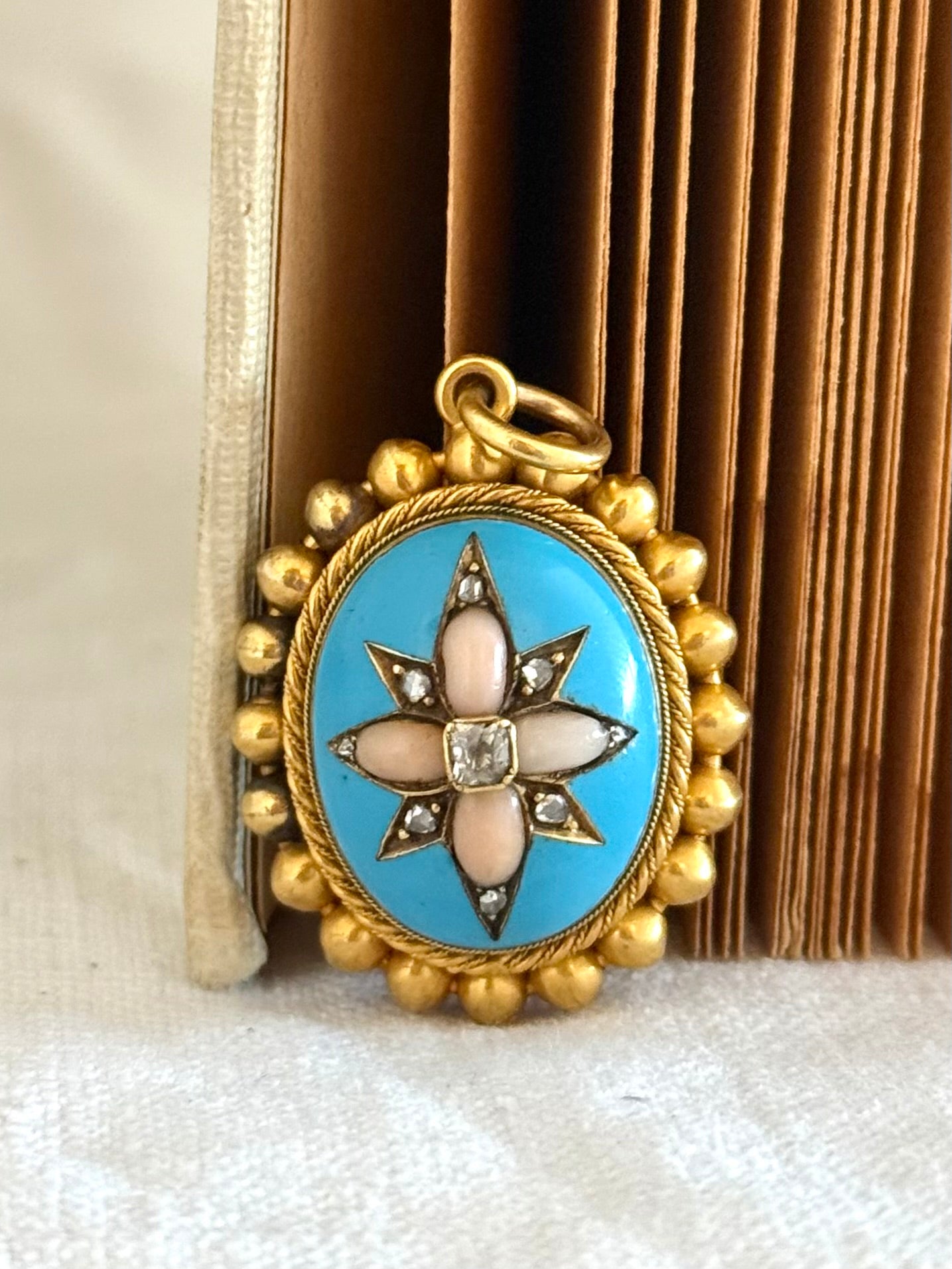 .15ct .1850s .1860s antique Victorian Yellow Gold Cushion cut Diamond Rose Cut Diamond star starburst Angel Coral and Blue Enamel Etruscan Revival Beaded border Mourning locket pendant