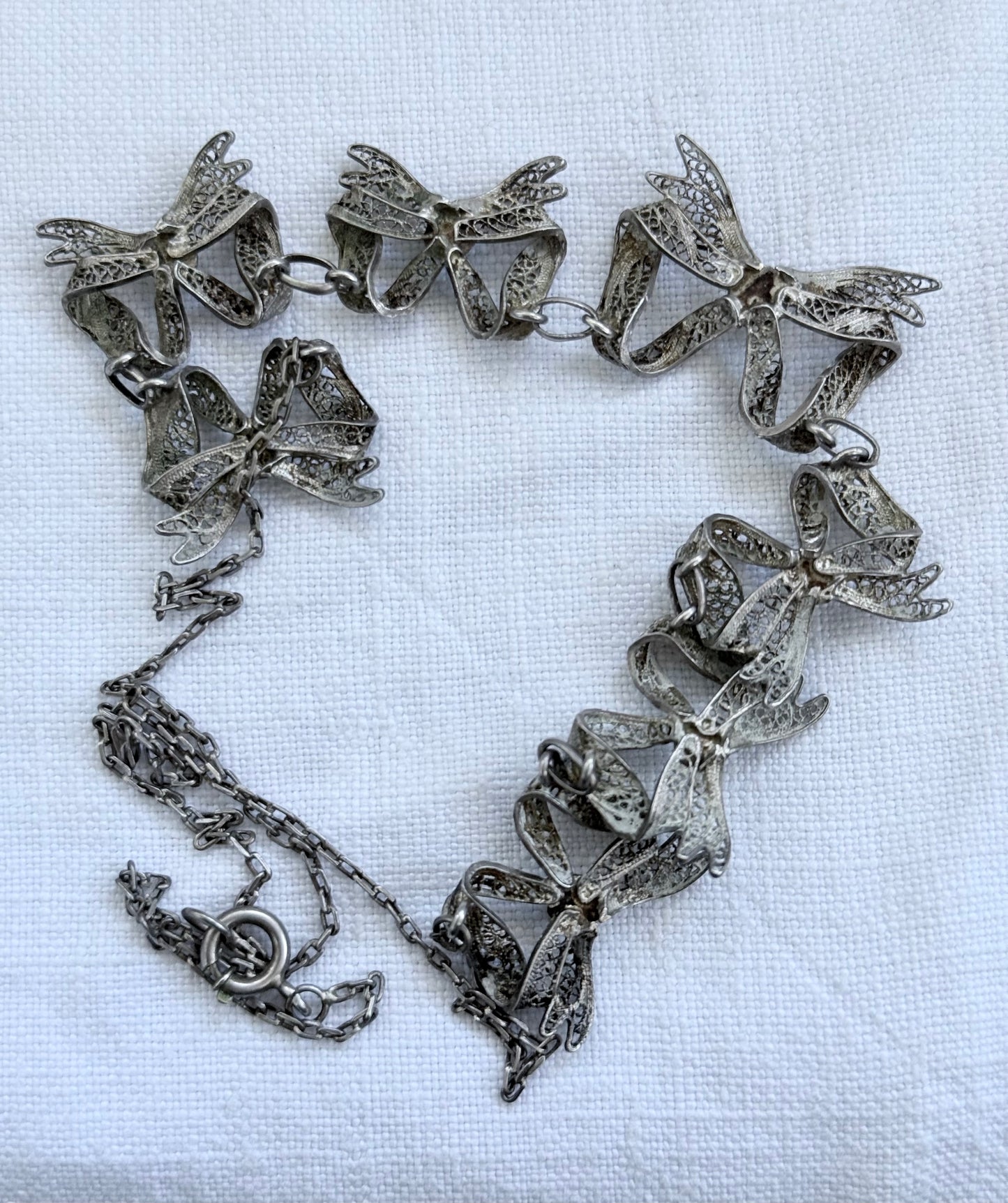 .1900s .1930s .916 silver vintage open work filigree wirework Bow Ribbon chain necklace