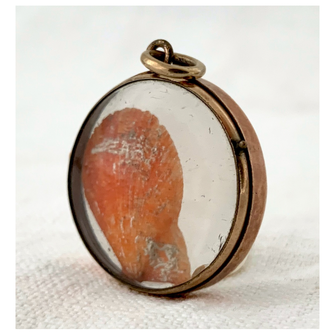 .1870s .1880s antique and very rare rock crystal Victorian solid rich gold pool of light style sought after antique orb circle memory locket.