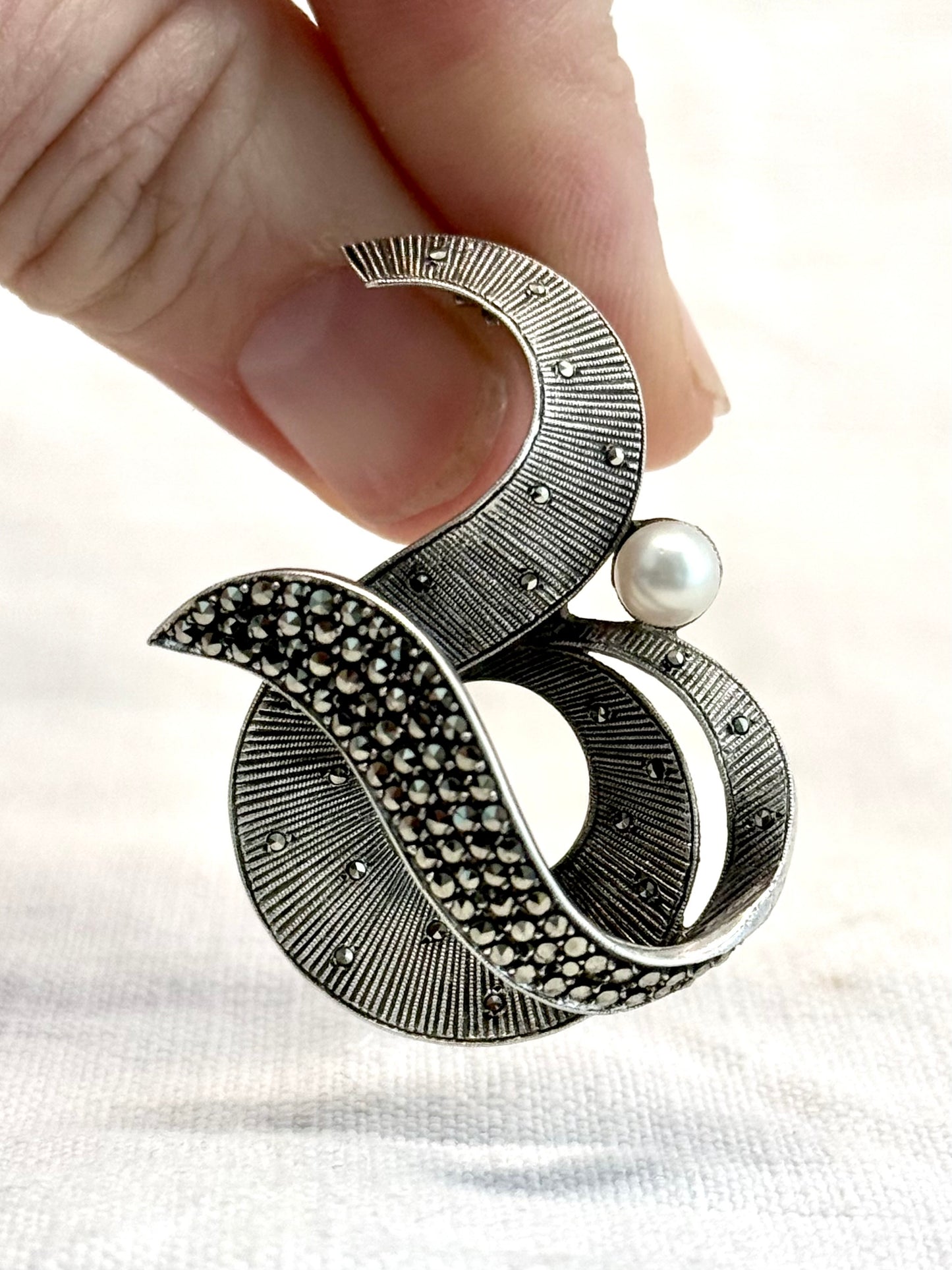 .1940s .1950s .925 silver Theodor Fahrner Mid Century Modern Art Deco revival renowned German Jurgendstill designer geometric swirl sterling silver, pearl and marcasite figural shape designer brooch pin