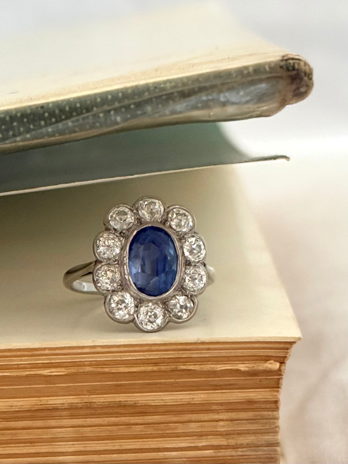 .18ct .1.20ct Old European cut diamonds and large 3.08ct Natural Sapphire era 1900s 1910s halo cluster white gold ring