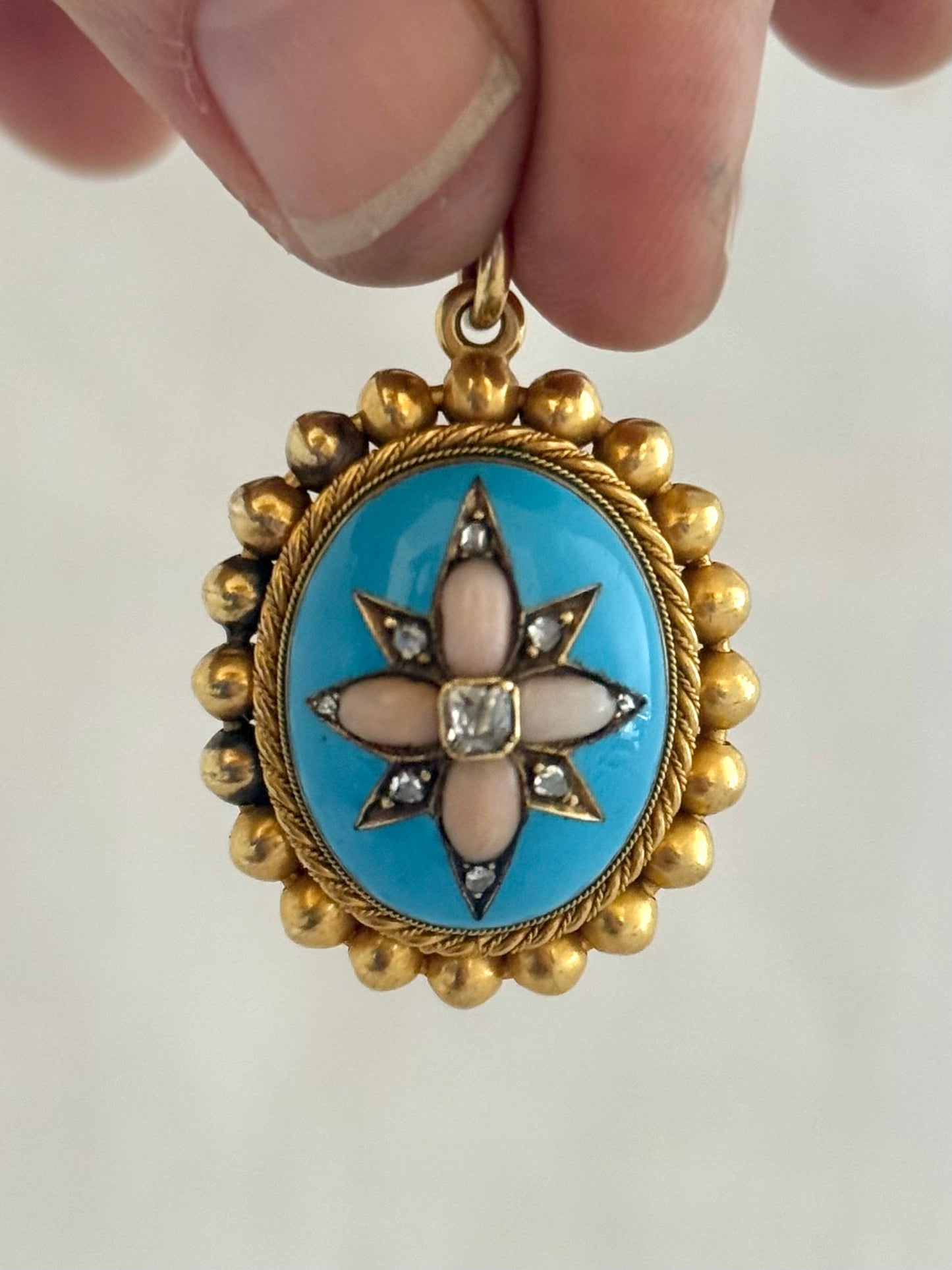 .15ct .1850s .1860s antique Victorian Yellow Gold Cushion cut Diamond Rose Cut Diamond star starburst Angel Coral and Blue Enamel Etruscan Revival Beaded border Mourning locket pendant