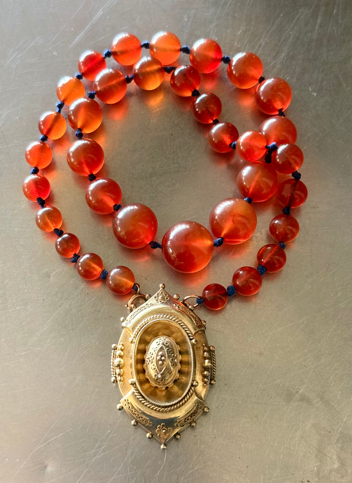 .1800s .375 .9ct gold Antique decorative fine Etruscan revival Victorian ornate gold oval pendant on luxury Carnelian bead graduated gemstone necklace setting