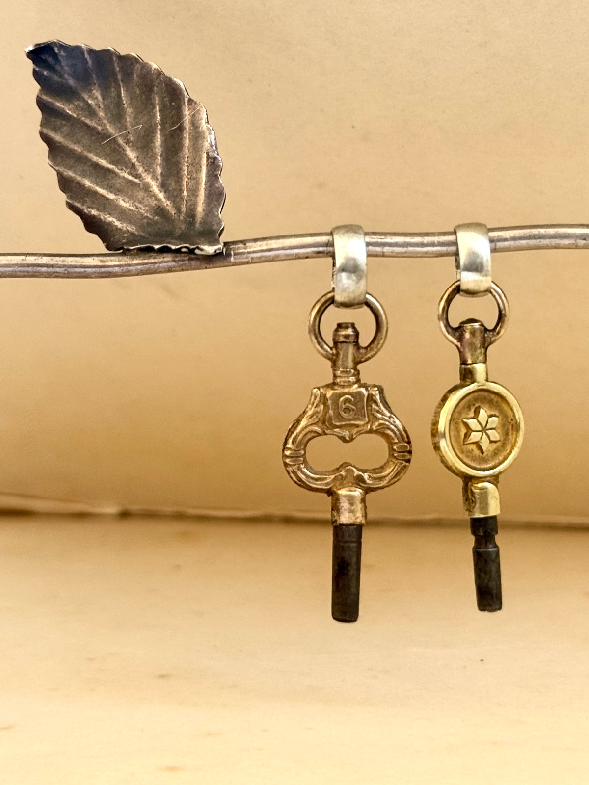 .1900s antique Art Nouveau brass watch winder key number 6 collectors silver fob pendant