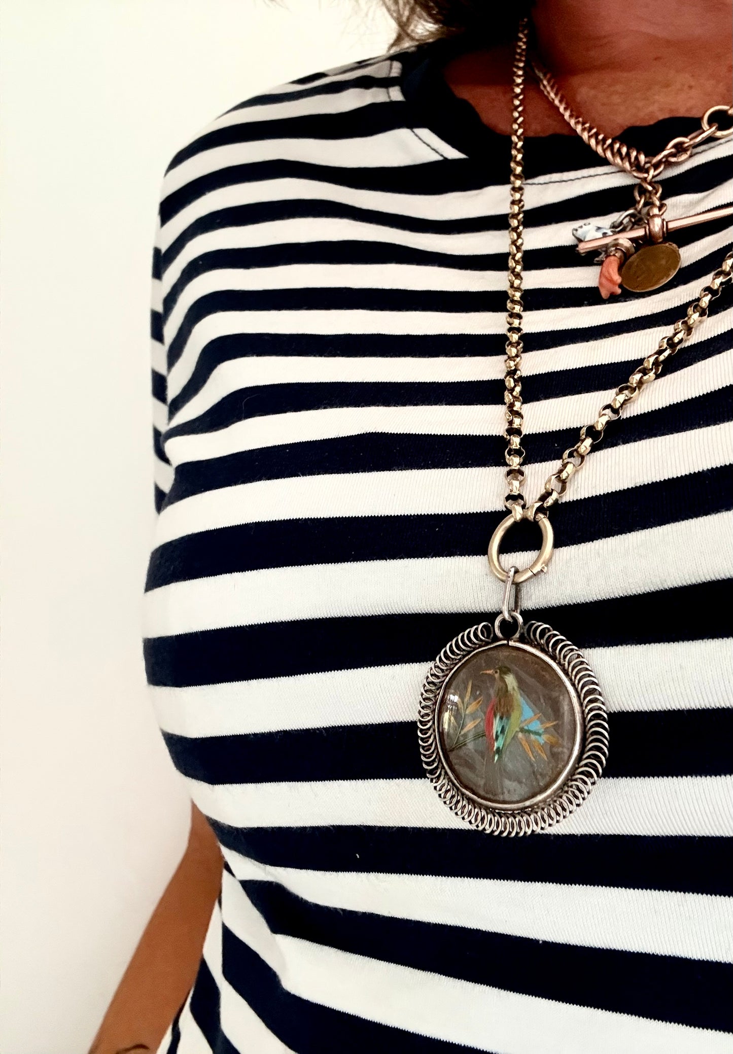 .1900s .1920s antique art fine feathered art exotic bird double sided silver locket pendant