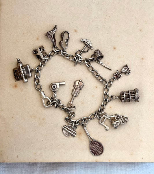 .14 charms .1970s .925 dangly keepsake charm bracelet