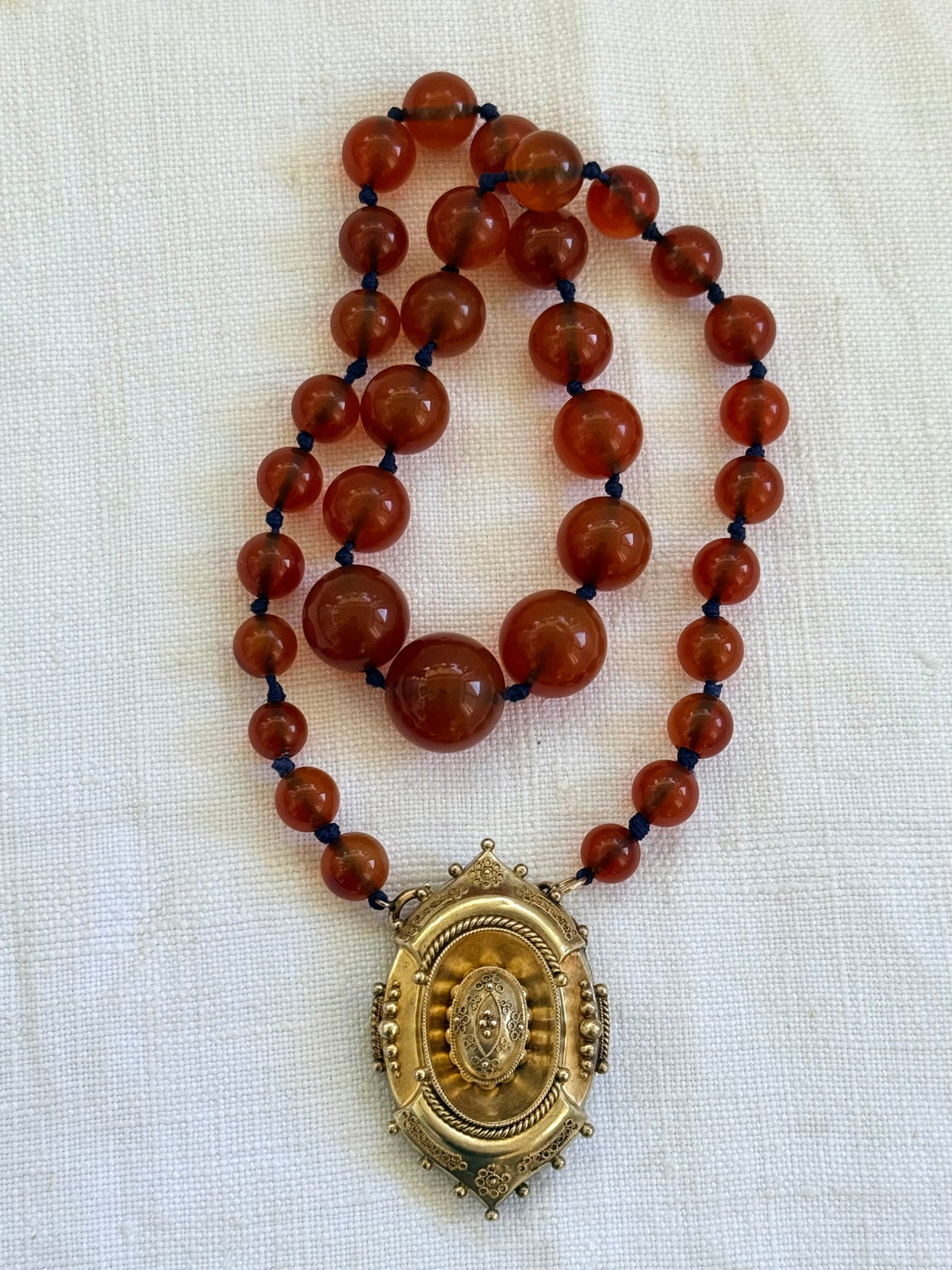 .1800s .375 .9ct gold Antique decorative fine Etruscan revival Victorian ornate gold oval pendant on luxury Carnelian bead graduated gemstone necklace setting