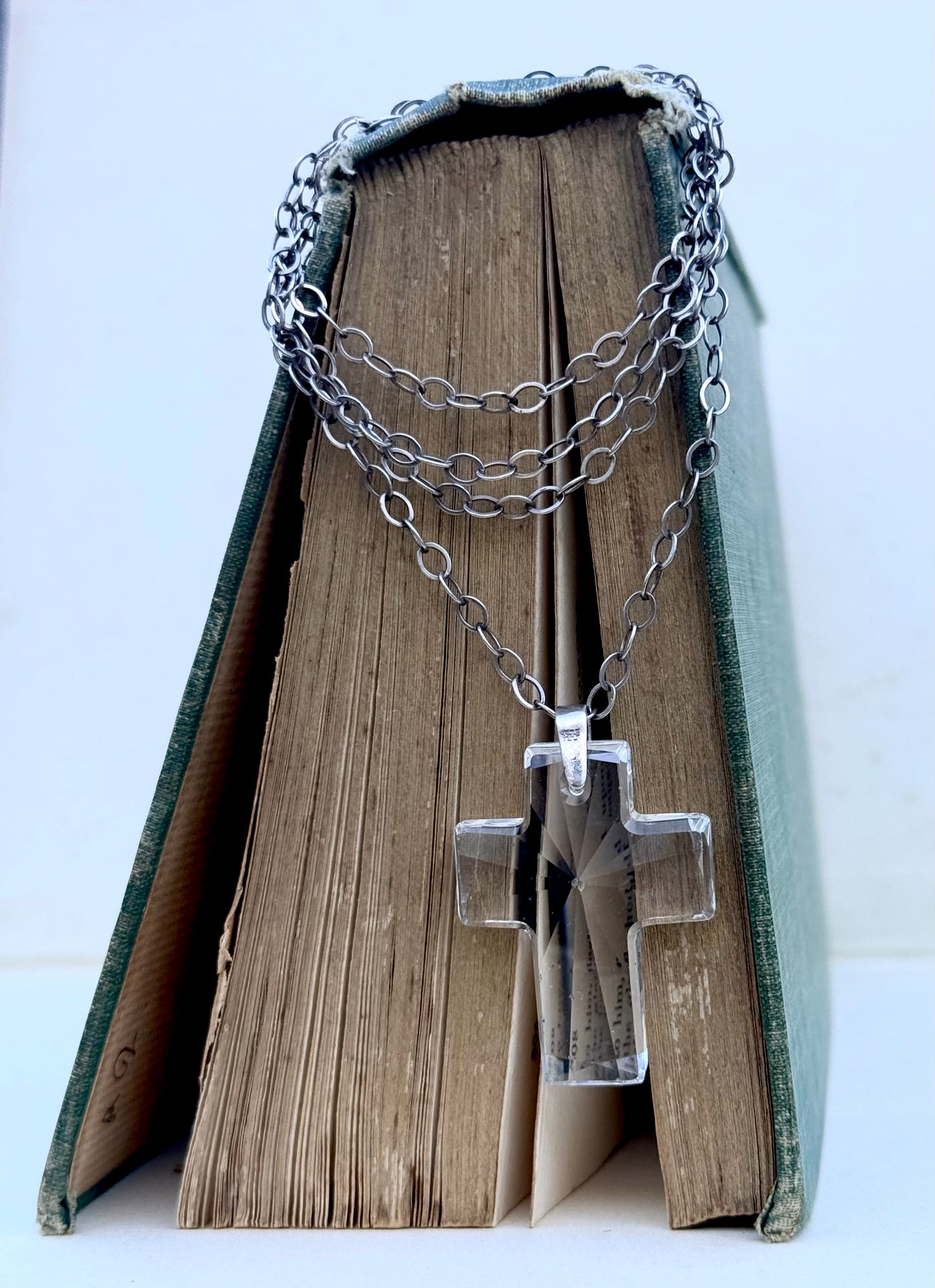 .925 .70cm long sterling silver modernist chain necklace with large faceted clear crystal glass cross pedant