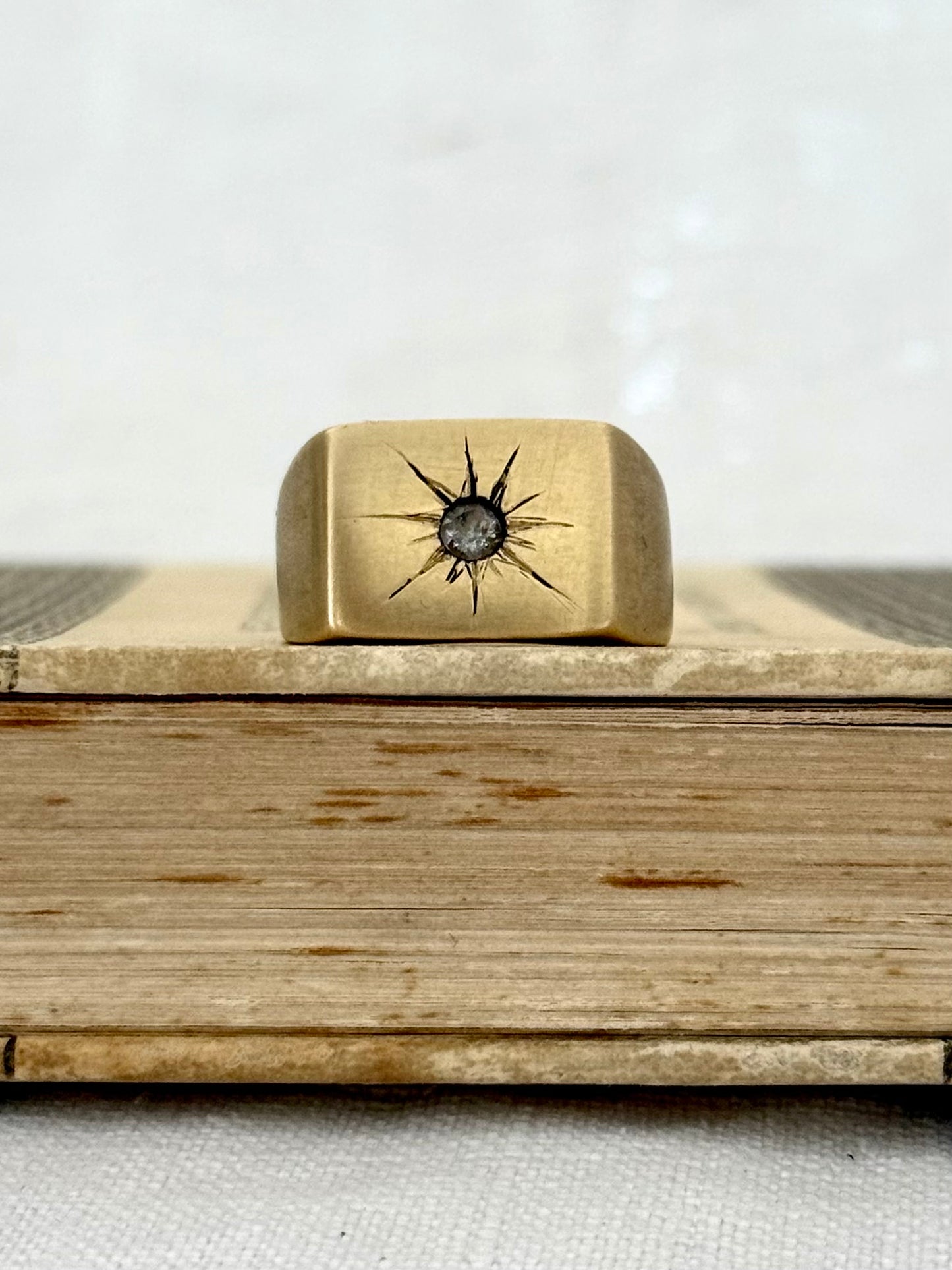 .1970s Gold tone Brass solid chunky signet ring with star burst diamond cut gem