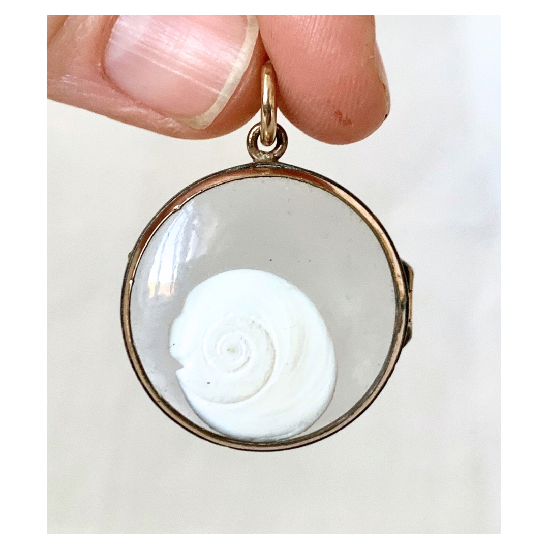 .1870s .1880s antique and very rare rock crystal Victorian solid rich gold pool of light style sought after antique orb circle memory locket.