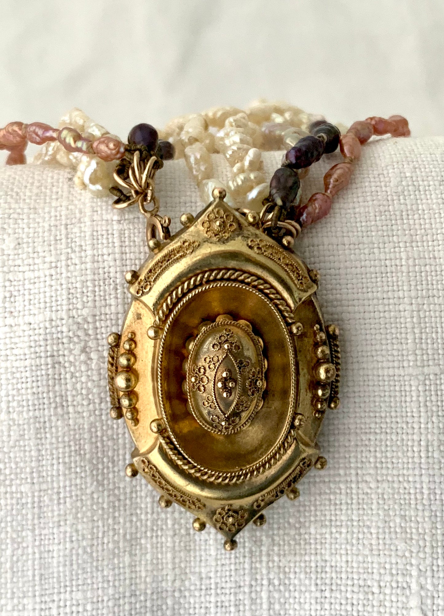 1800s 9ct gold Antique Etruscan revival Victorian yellow gold high detailed ornate oval pendant on dreamy shell coloured multi string 5 x string fresh water rice pearl necklace