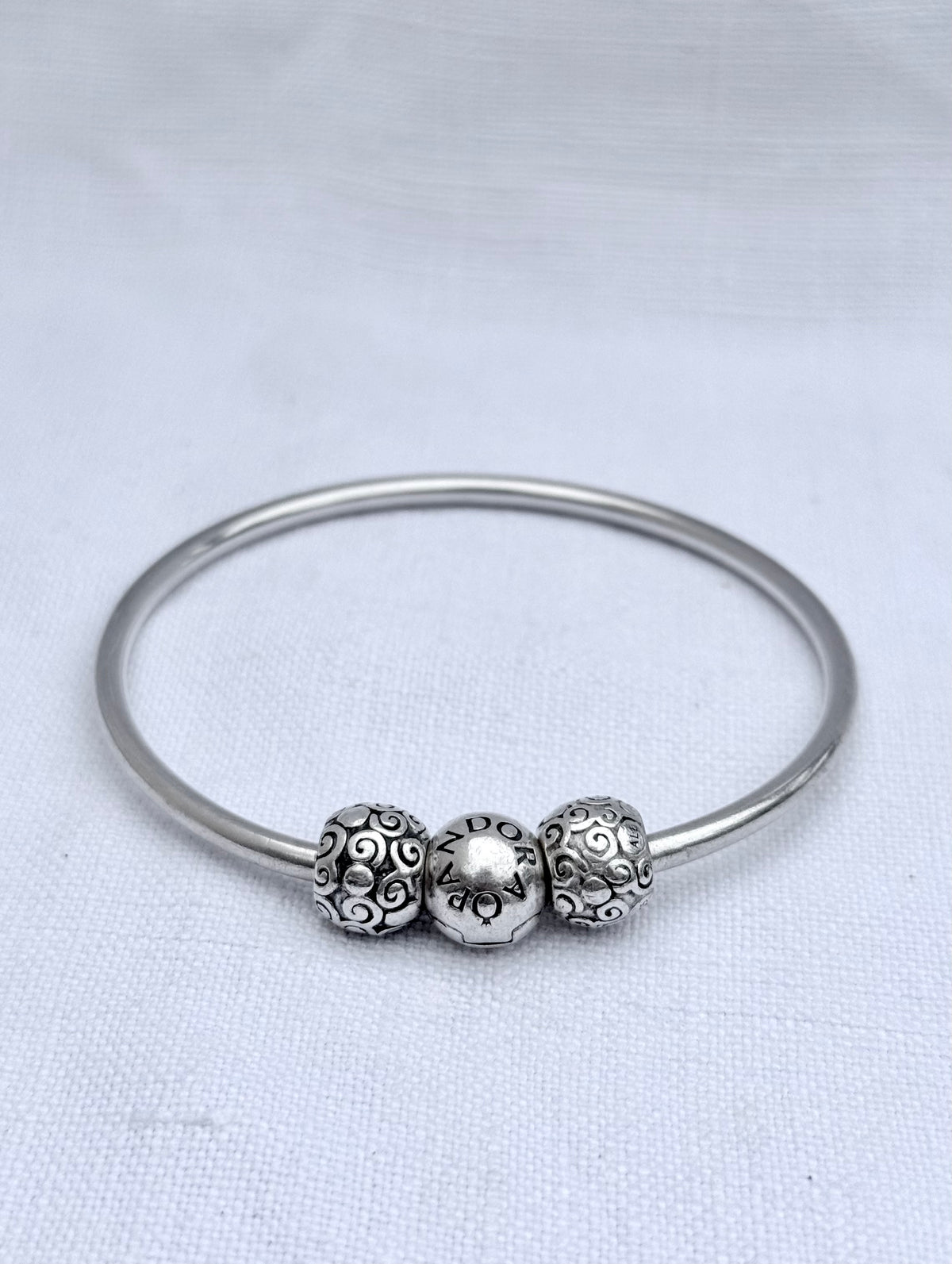 .925 signed Pandora Moments classic sterling silver ball clasp bangle with two screw on filigree form ball charms