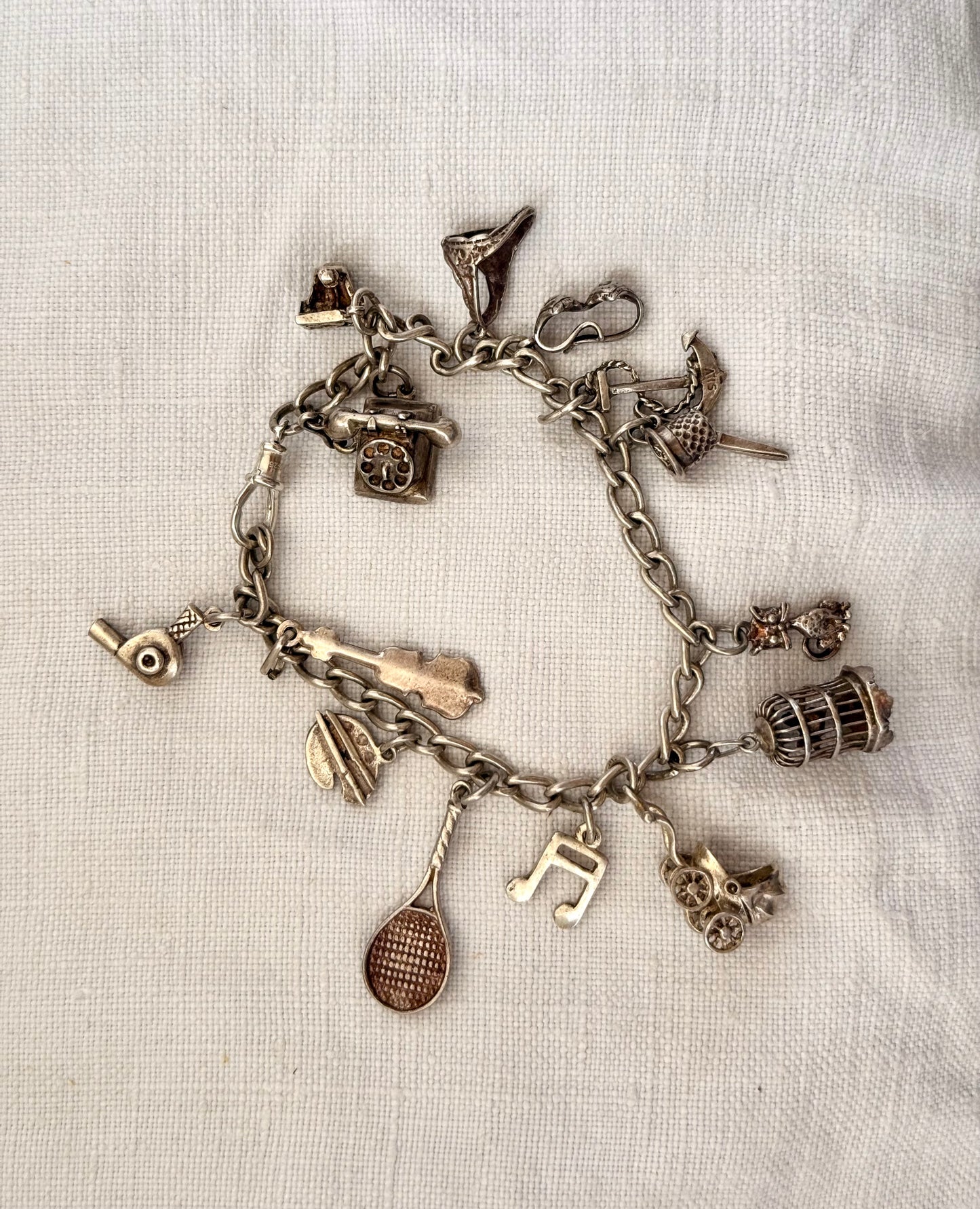 .14 charms .1970s .925 dangly keepsake charm bracelet