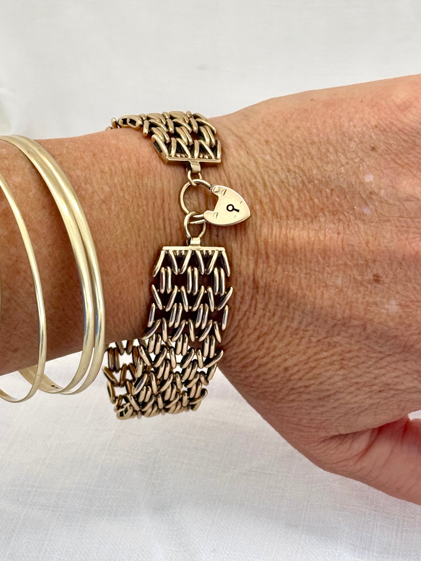 .1960 .1964 .375 9ct gold solid fancy link wide chunky width fancy link gate chain chain bracelet with gold heart padlock clasp