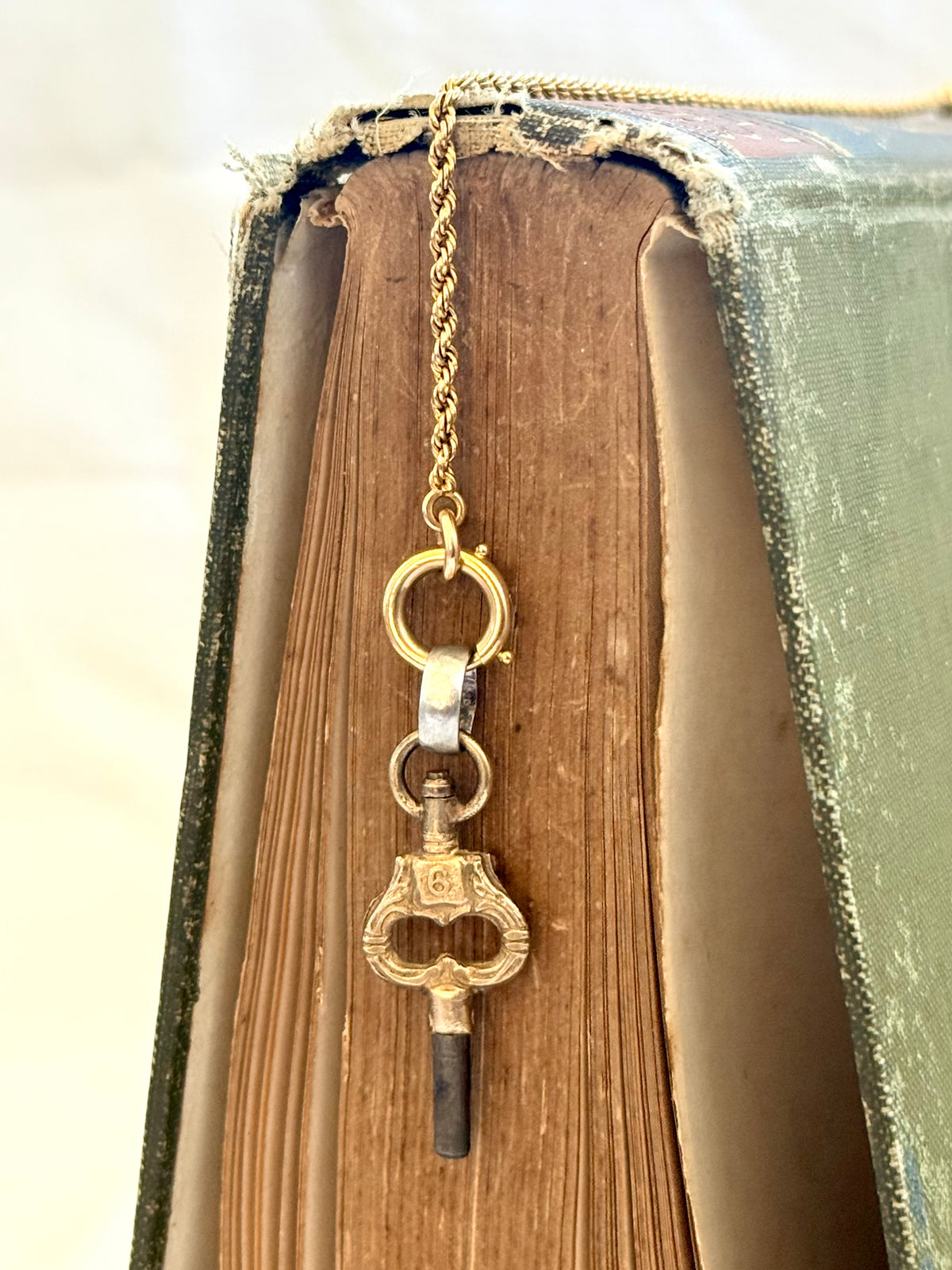 .1900s antique Art Nouveau brass watch winder key number 6 collectors silver fob pendant
